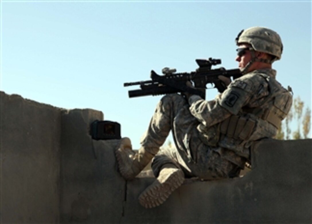U.S. Army Pvt. David Stufflebeam, from 1st Squadron, 91st Cavalry Regiment, 173rd Airborne Brigade Combat Team, provides security during a mission to deliver a swing set to the village of Manghokhel in the Kherwar district of the Logar province of Afghanistan on Oct. 8, 2010.  The swing set was delivered to establish positive relations with the local Afghan populace and encourage more children to attend school.  
