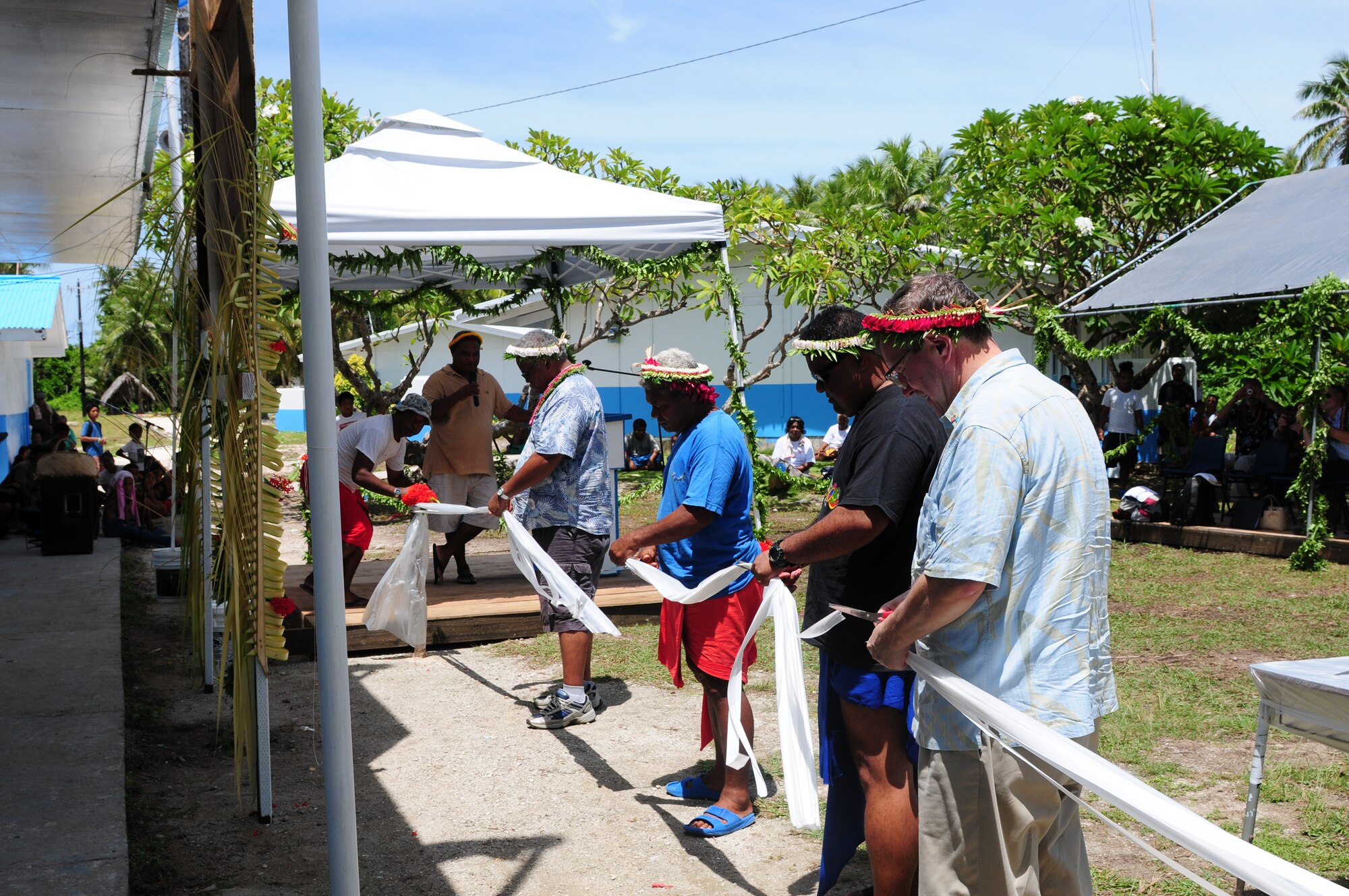 U.S. Ambassador Peter A. Praha (right), Yap and community leaders cut a ribbon at a dedication ceremony as part of Pacific Unity 2010 at the Outer Islands High School, Falalop, Yap, Federate States of Micronesia, on Sep. 22, 2010 . Pacific Unity 2010 is a humanitarian civil engineering effort in which engineers completely rebuilt, remodeled and repainted a high school on a remote island in Micronesia. (U.S. Air Force Photo/Master Sgt. Victoria Meyer)