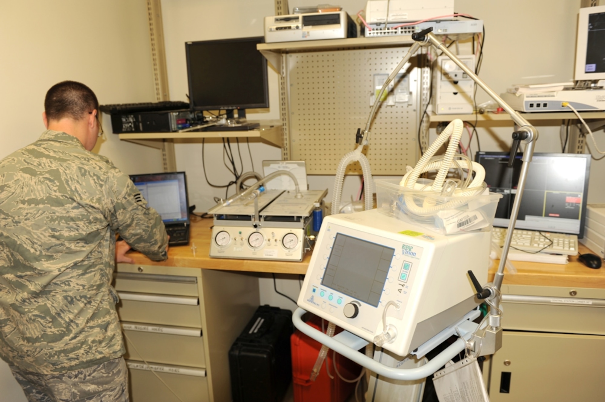 Senior Airmen Charles Heady, 673d Medical Group biomedical technician performs a diagnostic check on a ventilator in the Medical Equipment Repair Center at the DoD/VA Joint Venture Hospital, Oct. 4. (U.S.Air Force photo/Luke Waack)