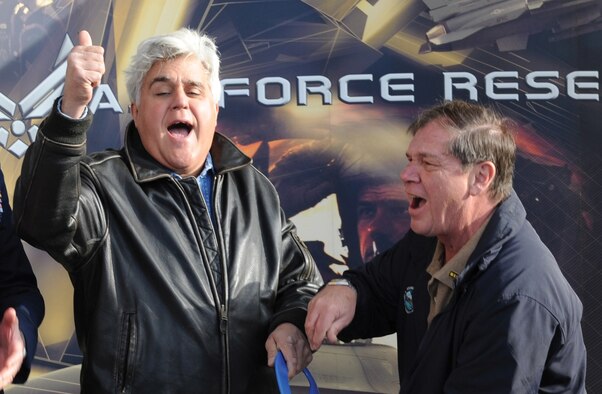 Jay Leno, Tonight Show host, celebrates after cutting the ribbon
at the Wasilla Air Force recruiting station, Saturday, with Wasilla
mayor, Verne Rupright. (U.S. Air Force photo/Luke Waack)