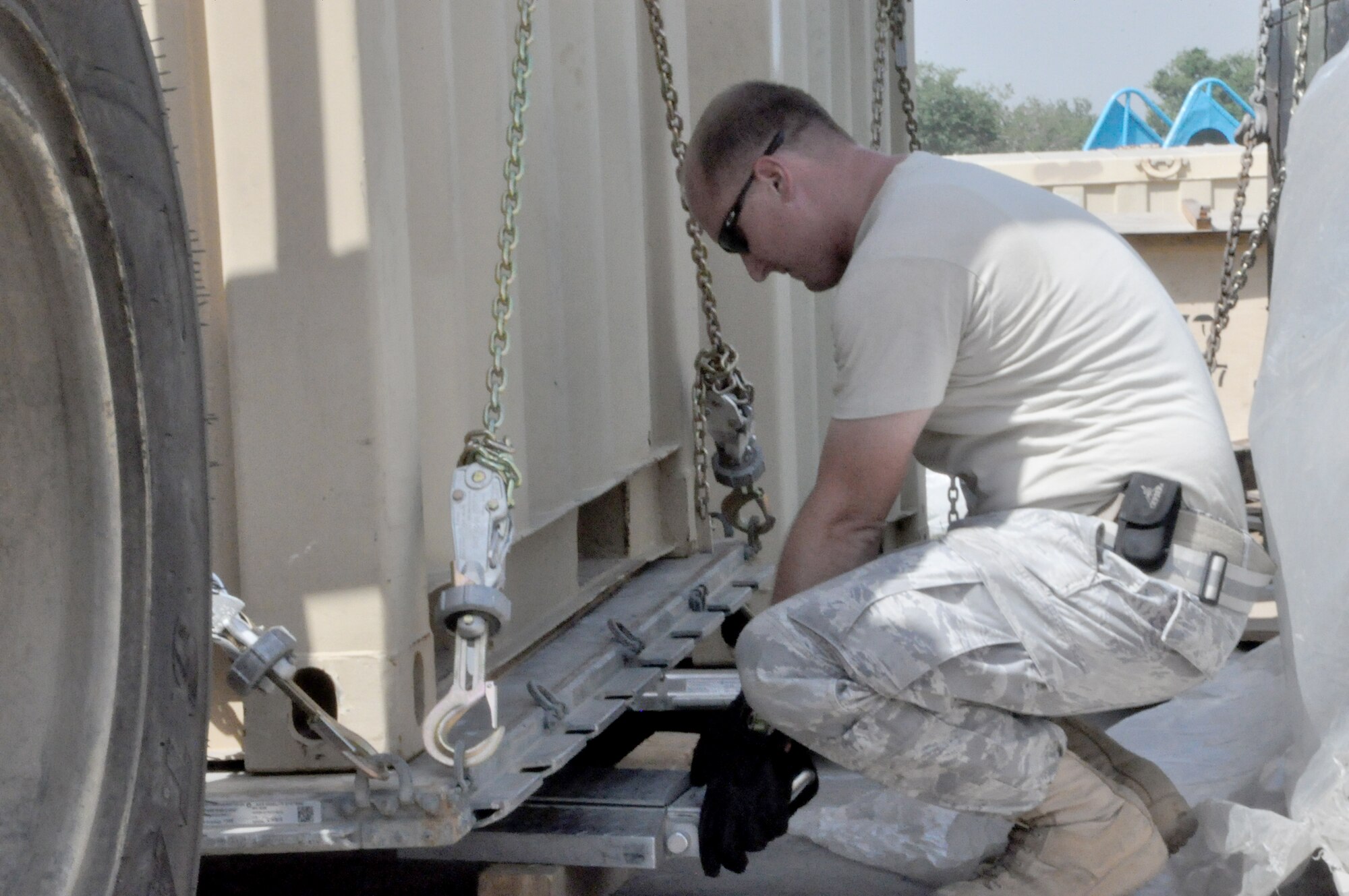 Staff Sgt. Joshua Gaines weighs a pallet Sept. 20, 2010, at the Pakistan Air Force Central Flood Relief Cell, PAF Base Chaklala.  Sergeant Gaines, a contingency response element aerial porter from the 818th Contingency Response Group at Joint Base McGuire-Dix-Lakehurst, N.J., arrived with the CRE in Pakistan Aug. 28 to augment flood relief operations.  He also is one of two Airmen to return after aiding the country with relief operations following the 2005 earthquake that killed more than 80,000 in northern Pakistan. (U.S. Air Force photo/Staff Sgt. Kali Gradishar)