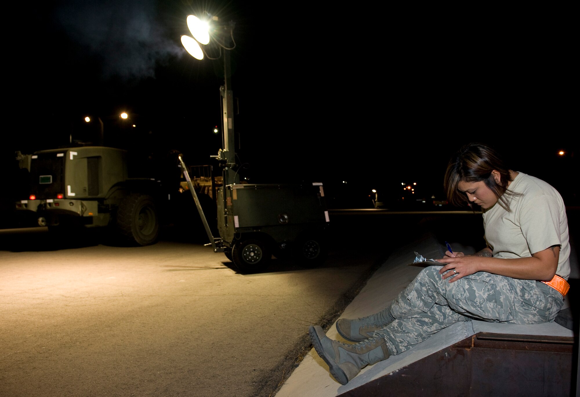 NELLIS AIR FORCE BASE, Nev. -- Senior Airman Zandra Mackrael, 99th Civil Engineering Squadron pest control apprentice, checks pallet documents for quality control during the Operational Readiness Exercise, Oct. 13. The ORE tests the 99th Air Base Wing’s ability to implement increased security procedures, gain 100 percent accountability of all Airmen, prepare the wing for quick deployment and continue with daily operations that help accomplish the Air Force mission. (U.S. Air Force photo by Senior Airman Brett Clashman/Released)