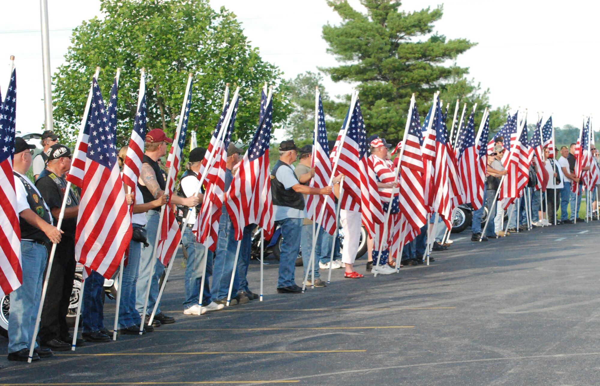 Veterans proudly display American Flags to honor Air Force Tech. Sgt. Roy DeWitt Prater. Sergeant Prater was conducting a rescue mission when his helicopter was shot down over South Vietnam in 1972. (Courtesy photo)