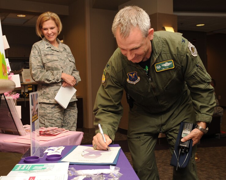 BARKSDALE AIR FORCE BASE, La. -- Col. Timothy Fay, 2nd Bomb Wing commander, signs a proclamation Oct. 8 at the 2nd Medical Group. The proclamation designates October as Domestic Violence Awareness Month at Barksdale.(U.S. Air Force photo/Airman 1st Class Sean Martin)