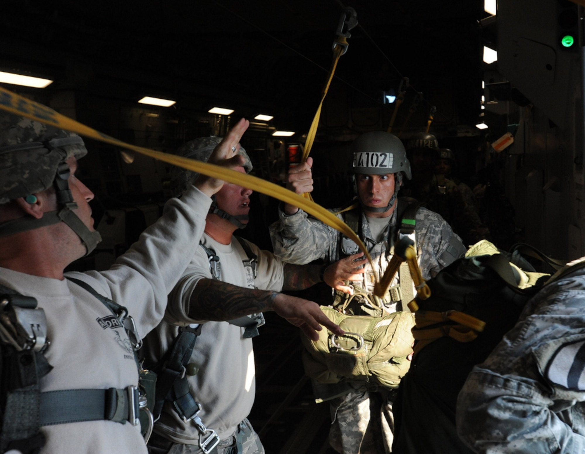 A determined 507th Airborne School studet prepares to jump out the side door of a C-17 over the Fort Benning drop zone Oct. 11. A C-17 from the 15th Wing at Joint Base Pearl Harbor Hickam made the long journey to Fort Benning to support the student jump requirements of the 507th AS. (U.S. Air Force photo by Staff Sgt. Nathan Allen)
