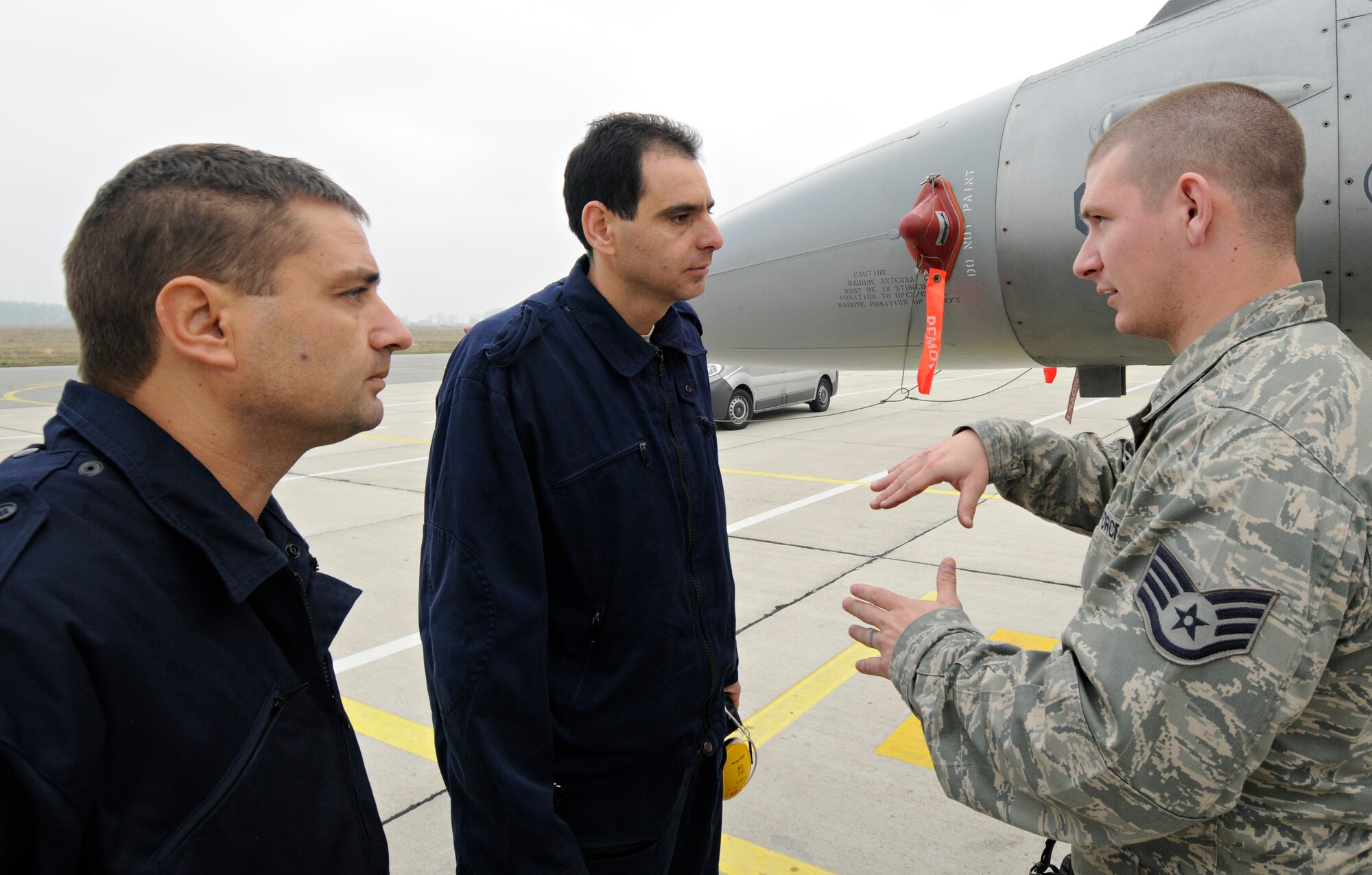 GRAF IGNATIEVO AIR FORCE BASE, Bulgaria - Staff Sgt. Adam Hendriksen, 52nd Aircraft Maintenance Squadron electrical and environmental technician, explains the components of an F-16 Fighting Falcon to his Bulgarian air force counterparts, Capt. Rumen Marinov, left, and 1st Lieutenant Nicolag Stefanov, during Operation Thracian Star Oct. 13. The three-week, combined exercise gave U.S. and Bulgarian military members in many career fields the opportunity to share ideas and train together. (U.S. Air Force photo/Staff Sgt. Benjamin Wilson)