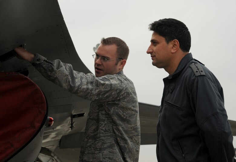 GRAF IGNATIEVO AIR FORCE BASE, Bulgaria - Staff Sgt. Joshua Adcock, 52 Aircraft Maintenance Squadron avionics systems journeyman, explains the avionic components of an F-16 Fighting Falcon to his Bulgarian air force counterpart, Capt. Pavlin Novakov, during Operation Thracian Star Oct. 13. During the exercise, members of the 52nd AMXS shared knowledge and experience with six Bulgarian maintainers about weapons, electronics, avionics and engine maintenance. (U.S. Air Force photo/Staff Sgt. Benjamin Wilson)