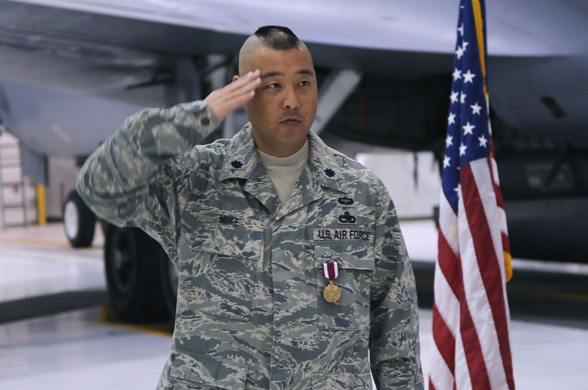 Lt. Col. Cory Miike, 319th Aircraft Maintenance Squadron commander, receives his final salute from the members of the 319th AMXS at Grand Forks Air Force Base Oct. 14. The ceremony is a time-honored tradition in the military, which visibly assures continuity of command. The 319th AMXS, which is part of the 319th Air Refueling Wing, was established in Feb. 1957 and this ceremony marks a near end to a 53-year legacy of tanker aircraft at Grand Forks AFB.  (U.S Air Force photo by Senior Airman Amanda N. Stencil)