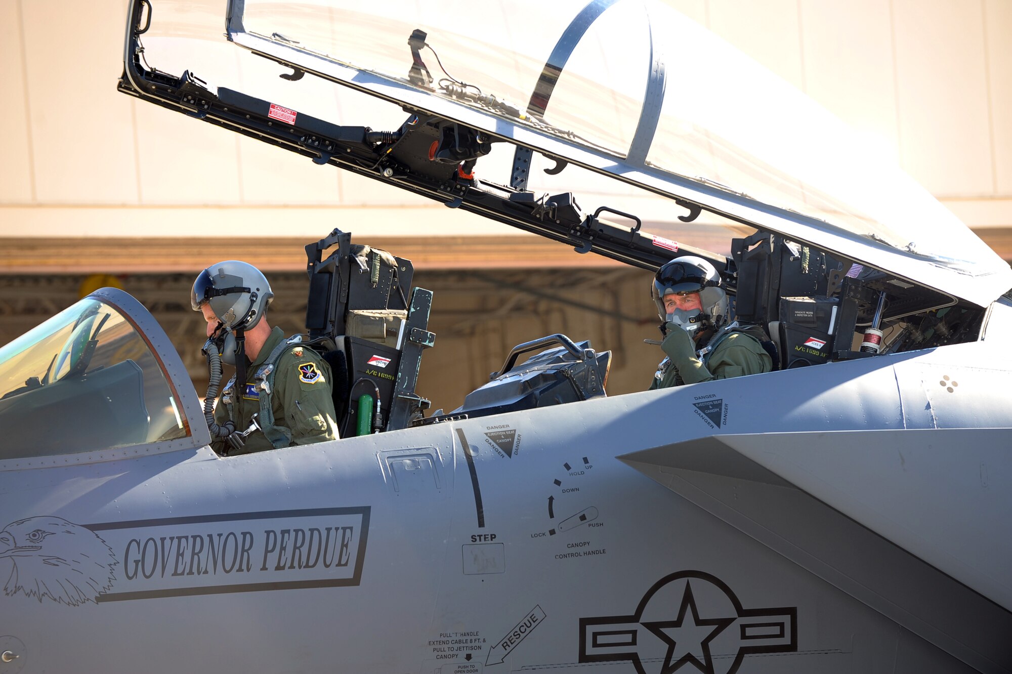 F-15 pilot Maj. Christopher "Torch" Coddington gives Gov. Sonny Perdue an orientation flight during his visit to Robins Oct. 8. The flight showcased the mission of the 402nd Maintenance Wing and 339th Flight Test Squadron. U. S. Air Force photo by Ray Crayton