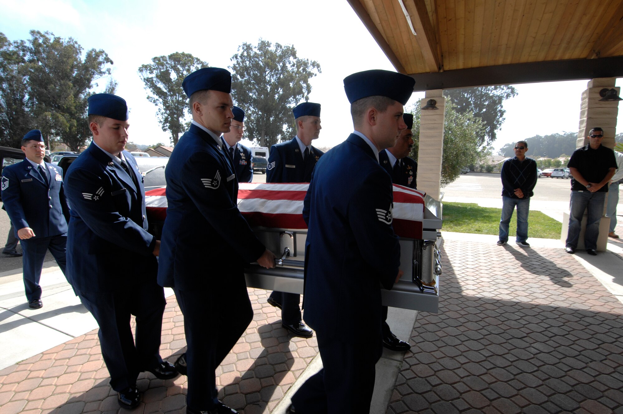 VANDENBERG AIR FORCE BASE, Calif. – Airmen from the 30th Civil Engineer Squadron Explosive Disposal Ordnance Flight here carry the flag covered casket of Senior Airman Daniel Johnson into Chapel 1 here for a memorial service held for the fallen Vandenberg Airman on Wednesday, Oct. 13, 2010. Airman Johnson was conducting explosive ordnance disposal operations in Hendu, Kandahar, Afghanistan, on Tuesday, Oct. 5, 2010, when an improvised explosive device detonated, taking his life. (U.S. Air Force photo/Staff Sgt. Levi Riendeau) 