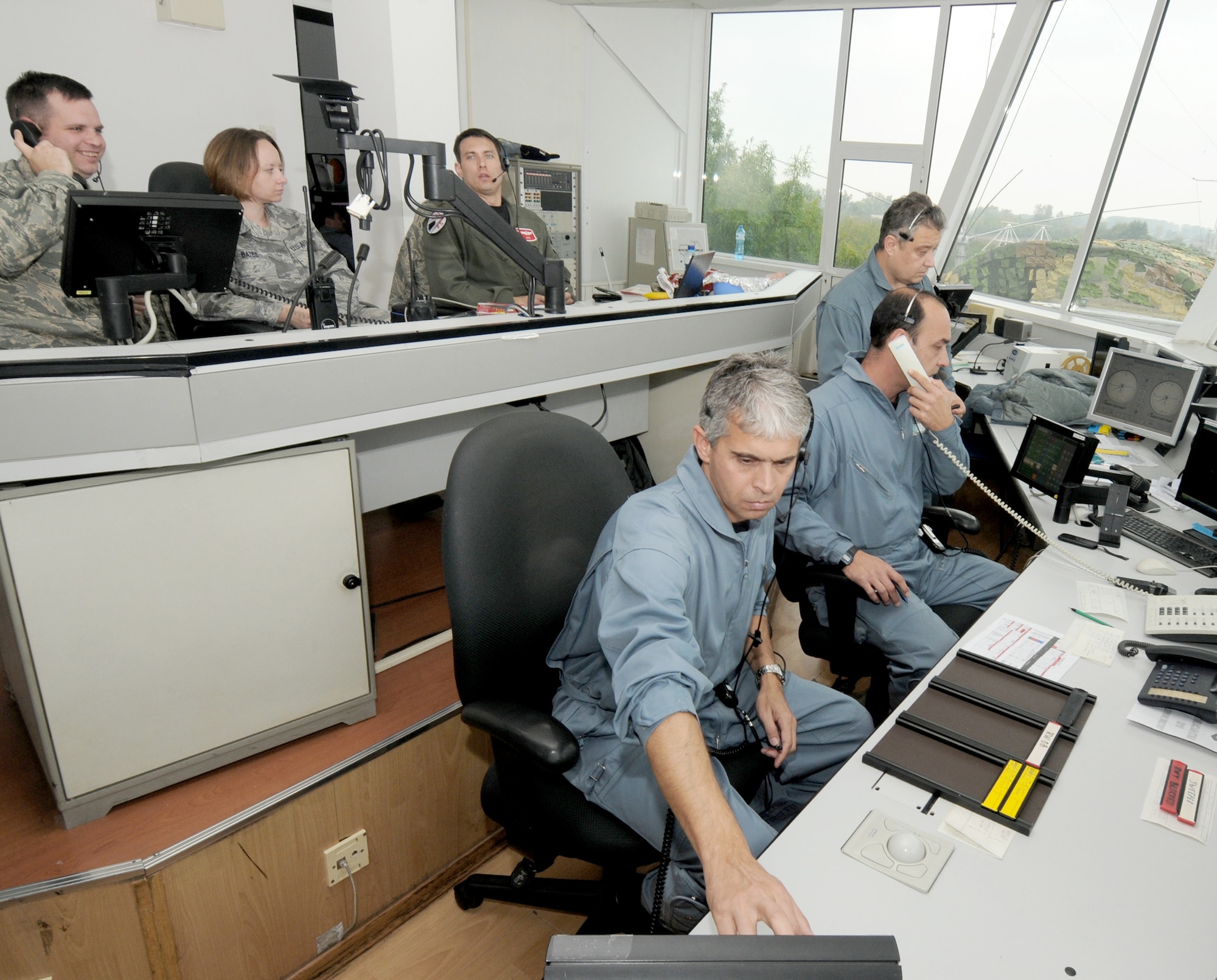 Bulgarian and U.S. Air Force air traffic controllers keep in constant contact with F-16 Fighting Falcons pilots on approach during Operation Thracian Star Oct. 12, 2010, in Bulgaria. The operation was a three-week, combined exercise that gave both U.S. and Bulgarian airmen the opportunity to train together and strengthen relationships (U.S. Air Force photo/Staff Sgt. Benjamin Wilson)