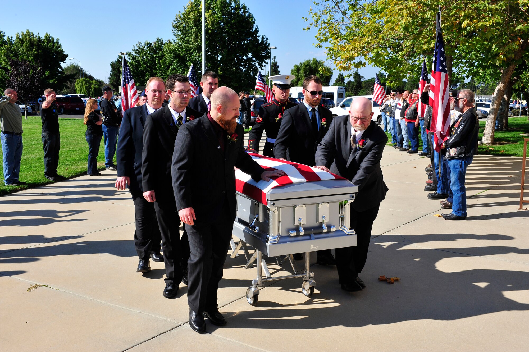 VANDENBERG AIR FORCE BASE, Calif. -- Family and friends of Senior Airman Daniel Johnson escort his remains into the First Christian Church in Santa Maria on Wednesday, Oct. 13, 2010. Airman Johnson, a 30th Civil Engineer Squadron Explosive Ordnance Disposal Flight technician, was killed in the line of duty Tuesday, Oct. 5, 2010, in Hendu, Kandahar, Afghanistan. (U.S. Air Force photo/Tech. Sgt. Luke Thelen)