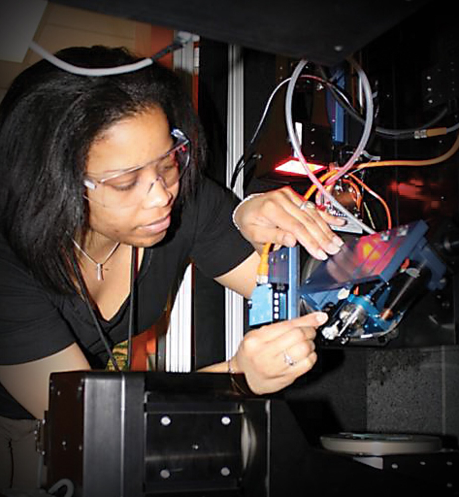 AFRL uses direct-write manufacturing to create new structures and integrated materials.  Pictured is a researcher employing Mesoscale Maskless Material Deposition, one of many DW techniques enabling the three-dimensional deposition of functional materials directly onto a material surface. (AFRL image)