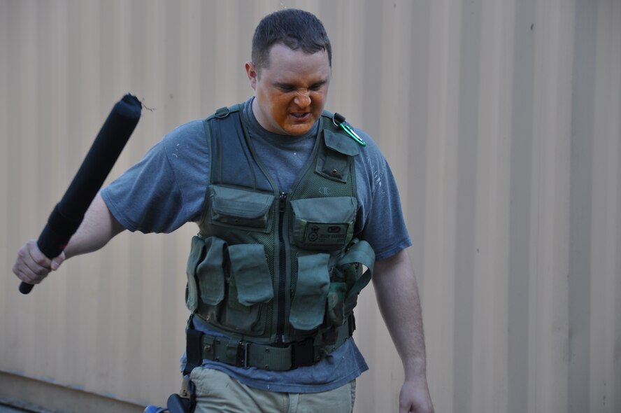 Tech. Sgt. Jesse Vaneusse, 934th Security Forces Squadron, shows his "warface"  after a blast of pepper spray in the face during training Oct. 12.  The training enabled SFS members to experience and understand the effects of pepper spray and practice performing their duties after being sprayed. (Air Force Photo/Paul Zadach) 