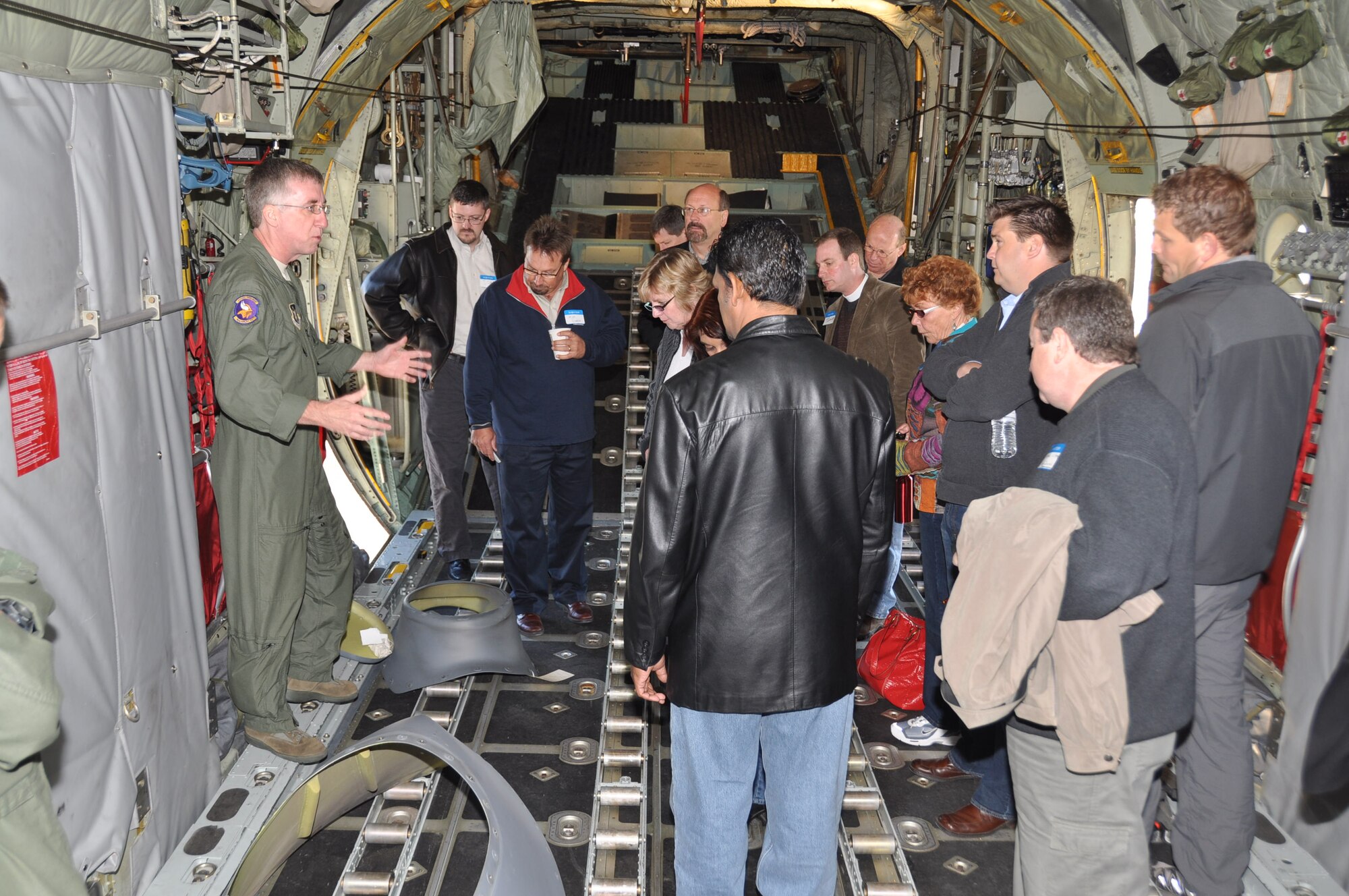 Master Sgt. Randy Lenton explains the duties of a loadmaster to clergy members during Clergy Day Oct. 13. (Air Force Photo/Paul Zadach)