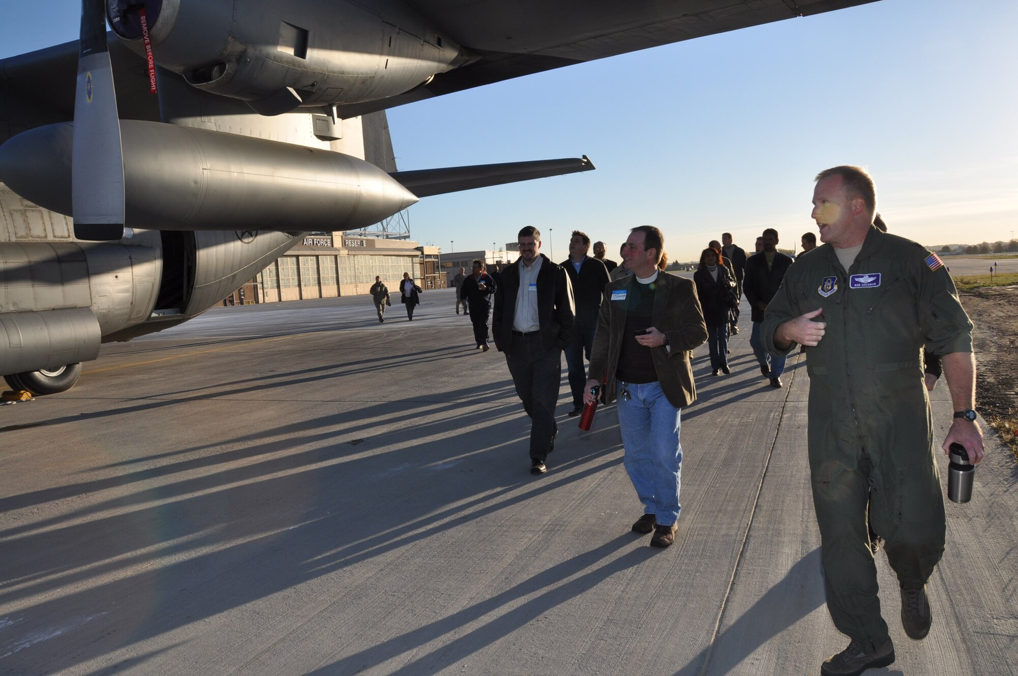 Lt. Col. Bob Hockman leads clergy members to a C-130 static display during Clergy Day Oct. 13. (Air Force Photo/Paul Zadach)