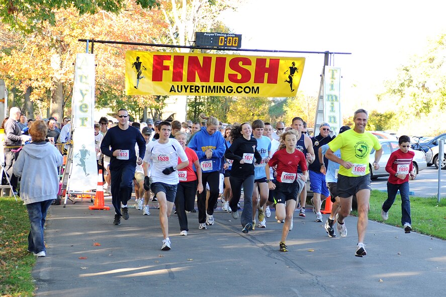 Participants race away from of the start line during the 1st Annual Hancock Field Family Readiness Program 5K Run, held October 9th at the Willow Bay shelter in Onondaga Lake Park. Over 200 people participated in the walk/run, which was held to support the New York State Family Readiness program. (USAF Photo by: SSgt. James N. Faso II/Released)



