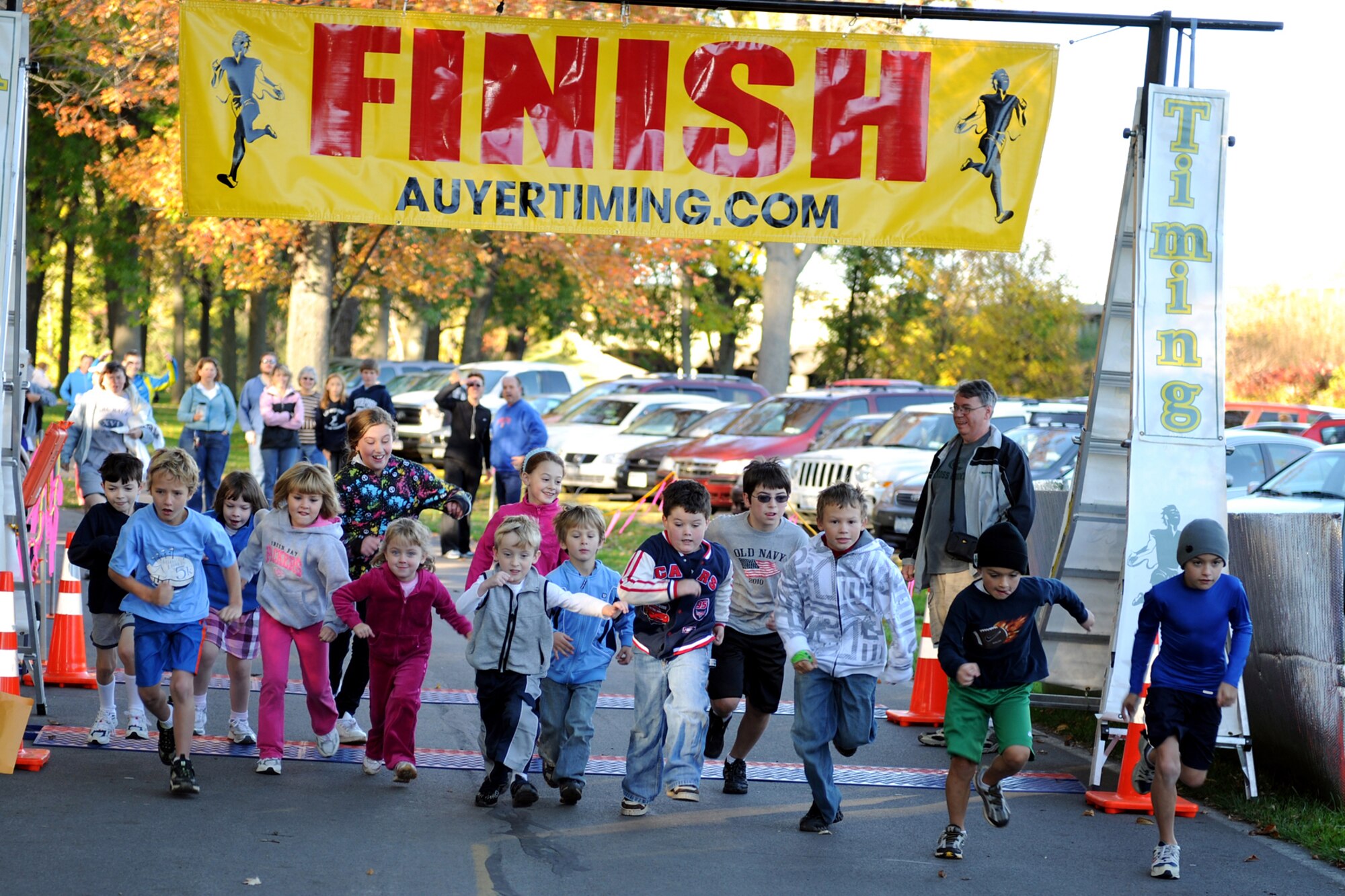 Youth participants race away from of the start line during the 1st Annual Hancock Field Family Readiness Program 5K Run, held October 9th at the Willow Bay Shelter in Onondaga Lake Park. The youth participants ran just 1k and the eventual winner (pictured far right) Conor McManus, age 9, crossed the finish line with an official time of 3:29. (USAF Photo by: SSgt. James N. Faso II/Released)

