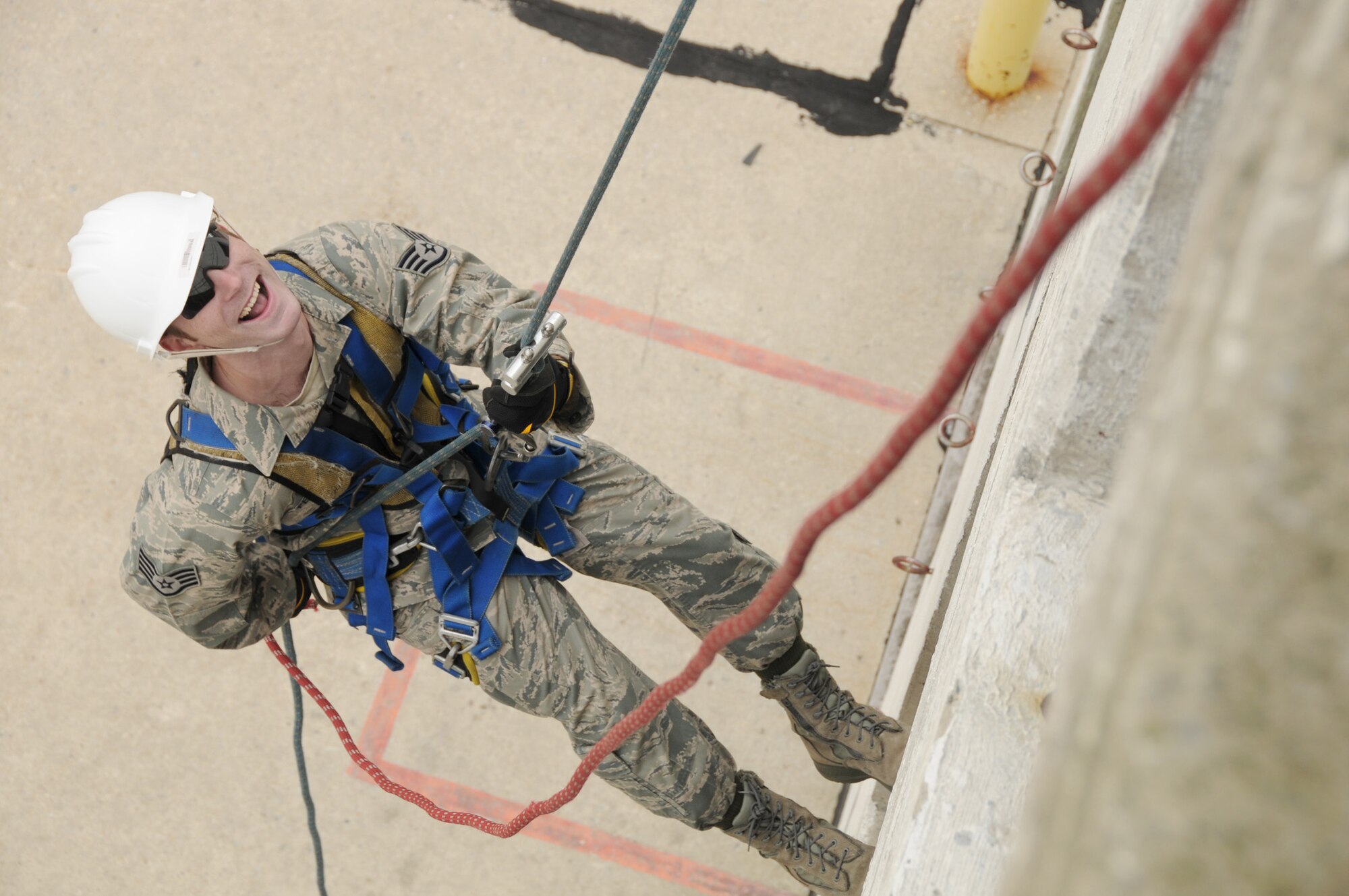 Staff Sgt. David Ferguson rappels down the side of a training facility Oct. 5, 2010, at the Toledo Fire and Rescue Department Training Academy in Ohio.   Sergeant Ferguson is assigned to the Ohio Air National Guard's 180th Fighter Wing. (U.S. Air Force photo/Senior Airman Amber Williams)