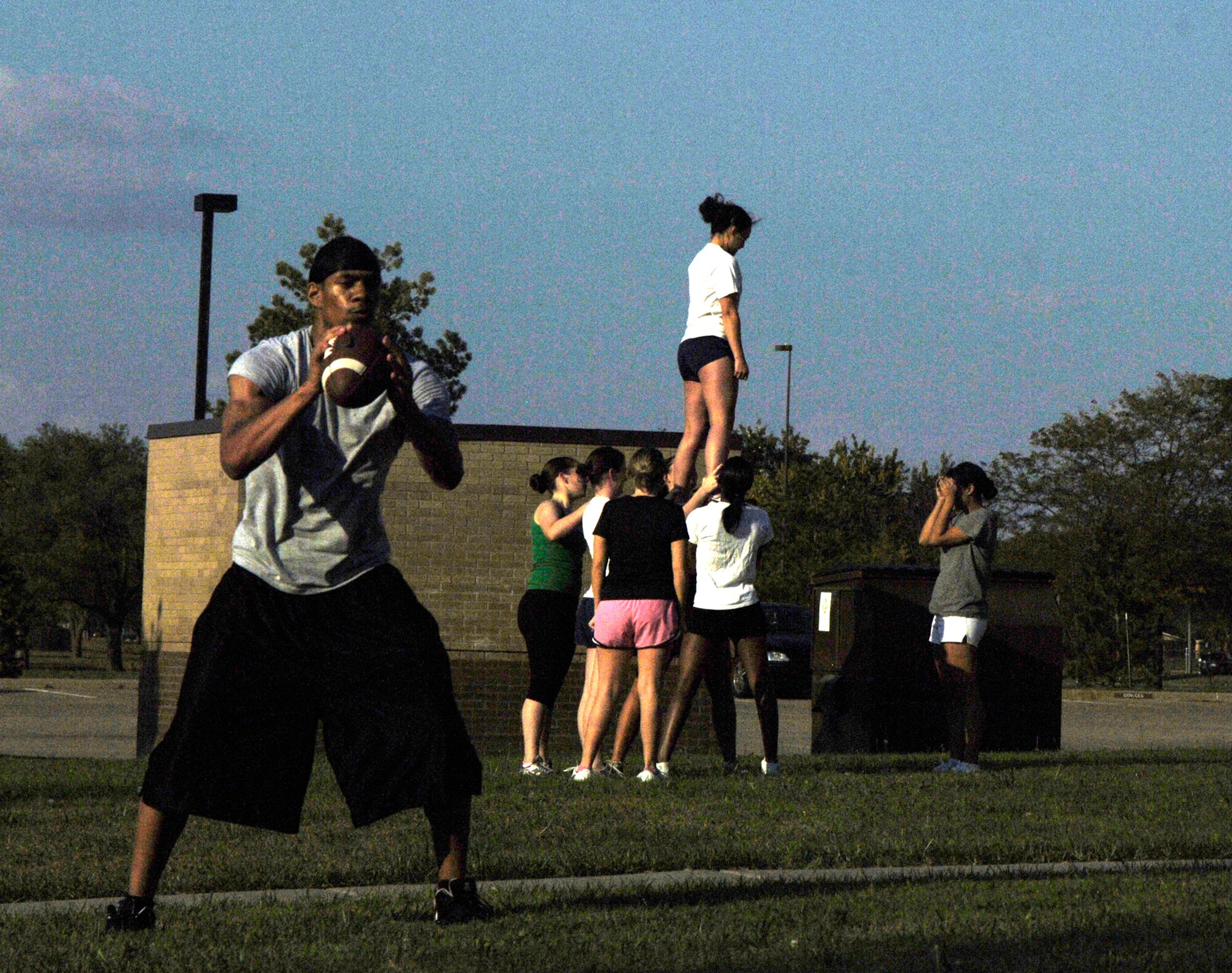 Airman 1st Class John Holt, 22nd Medical Support Squadron records technician, helps McConnell Airmen prepare  Oct. 12, 2010, for an upcoming flag football game at McConnell Air Force Base, Kan. McConnell’s team and cheerleaders will travel to Fort Riley, Kan., to compete in a game against U.S. Army Soldiers.  (U.S. Air Force photo/Airman 1st Class Armando A. Schwier-Morales)