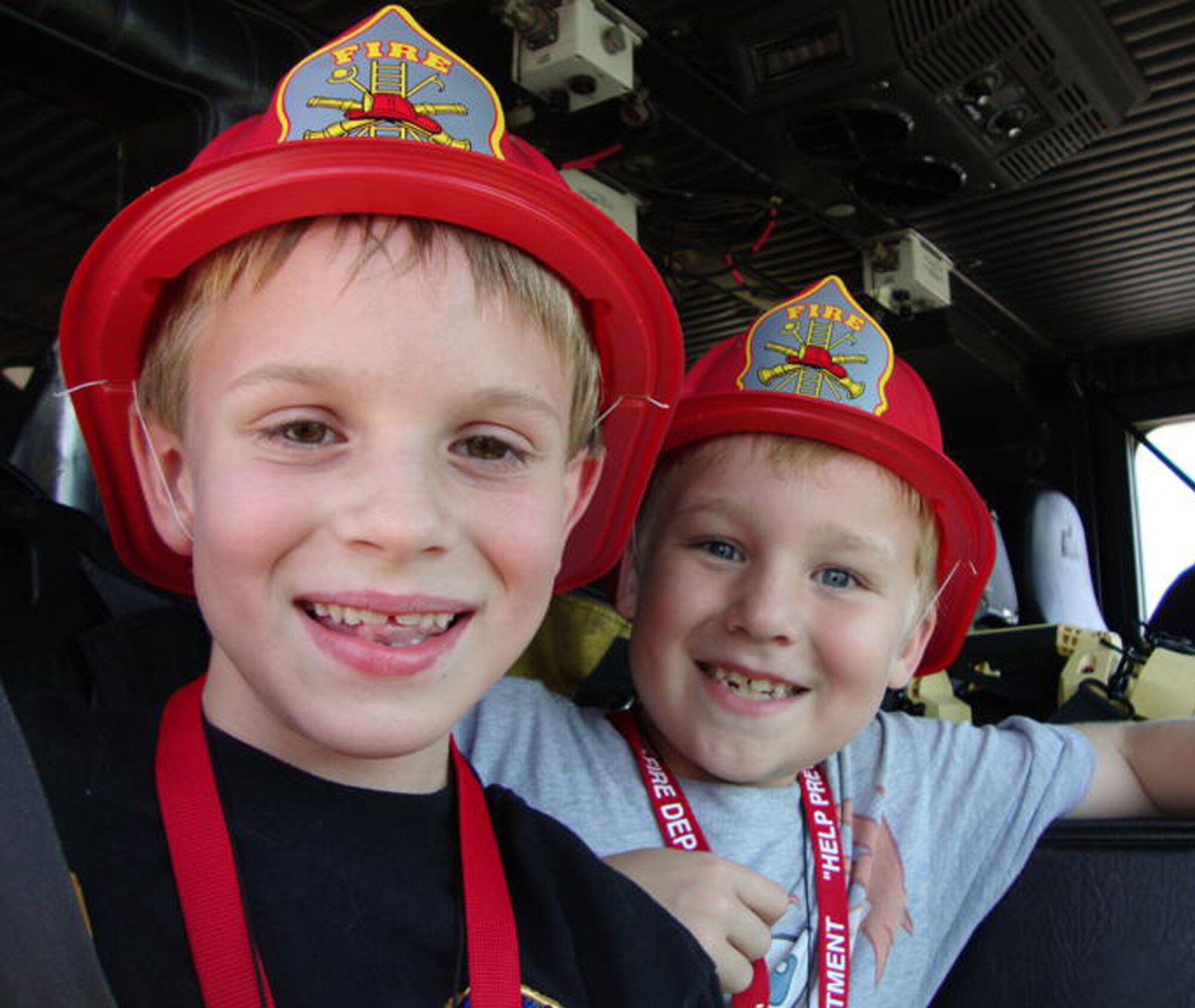 Sawyer Stone, left, and A.J. Wright enjoy the fire truck ride during the fire  department’s open house Saturday. Sawyer, 8, is the son of Col. Lynn Connett, 81st Training Group, and Col. Jay Stone, Air Force Medical Support Agency, Washington. Eight-year-old A.J. is the son of Lt. Col. Jonathan and Lisa Wright, 81st Contracting
Squadron.  (U.S. Air Force photo by Lt. Col. JonathanWright)