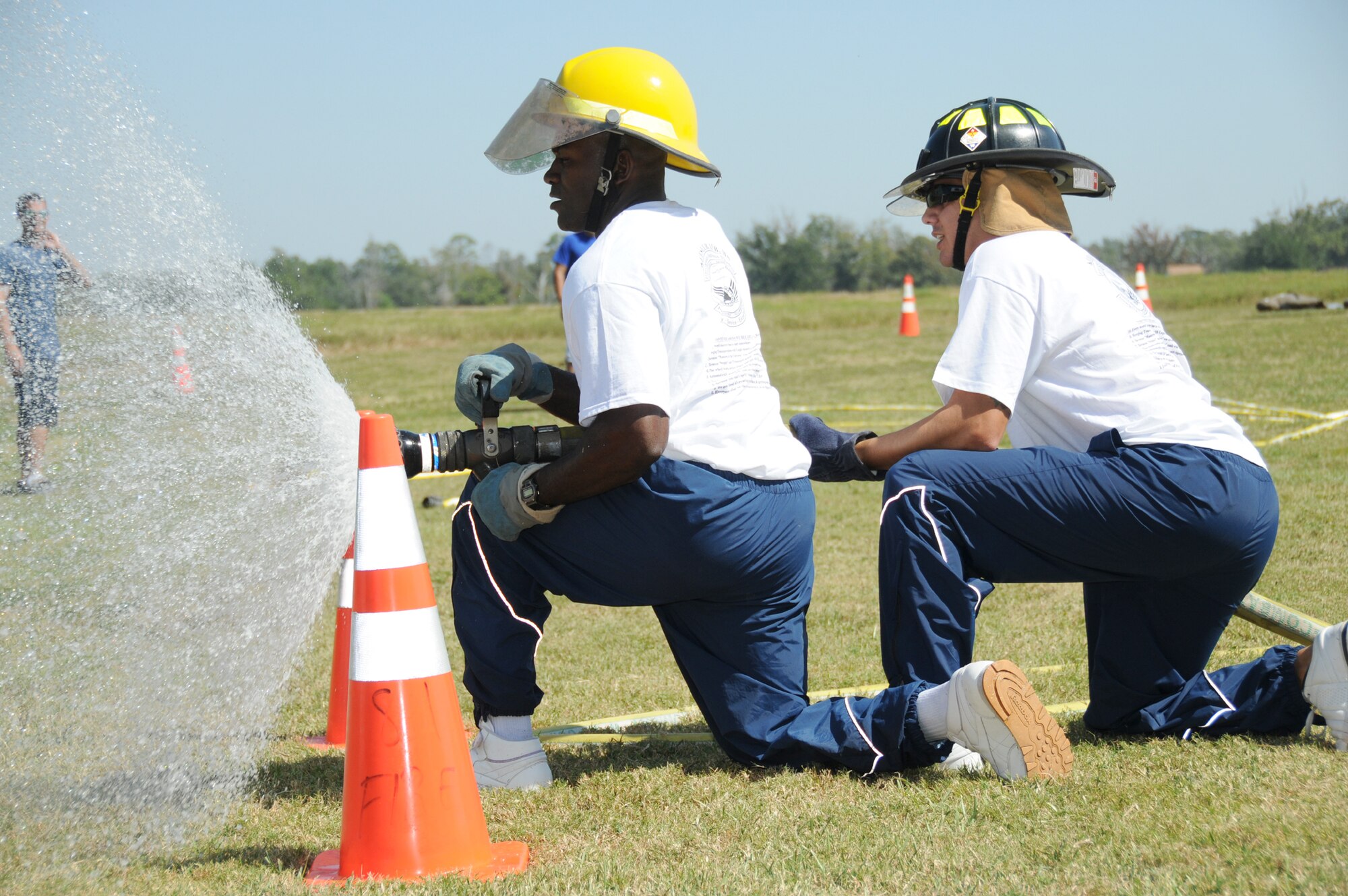Staff Sgts. Johnny Blakely, left, and Jose Ramos from the 81st Logistics Readiness
Squadron’s BadMotherTruckers, aimat targets during the hot shots competition.
Their team came in third place, just behind the chapel’s Holy Fire Squad.  (U.S. Air Force photo by Kemberly Groue)