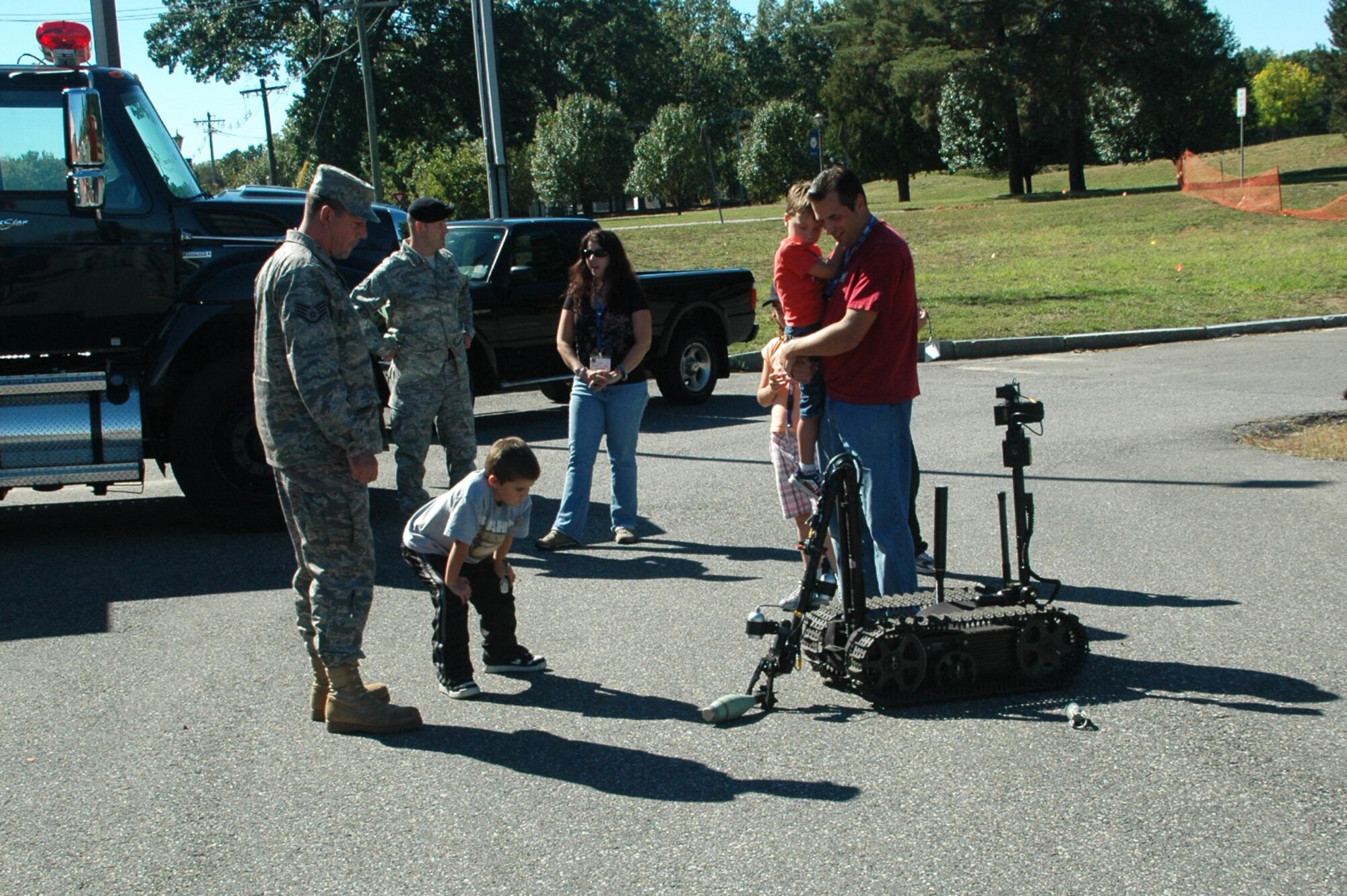 Brandon Hanechak, the first honorary Westover Pilot for a Day, observes an Explosive Ordnance Disposal bomb-bot as it crawls across the parking lot at the EOD facility.  Brandon came to Westover as the first participant in the Pilot for a Day program, which recognizes children who have faced medical hardships with courage.