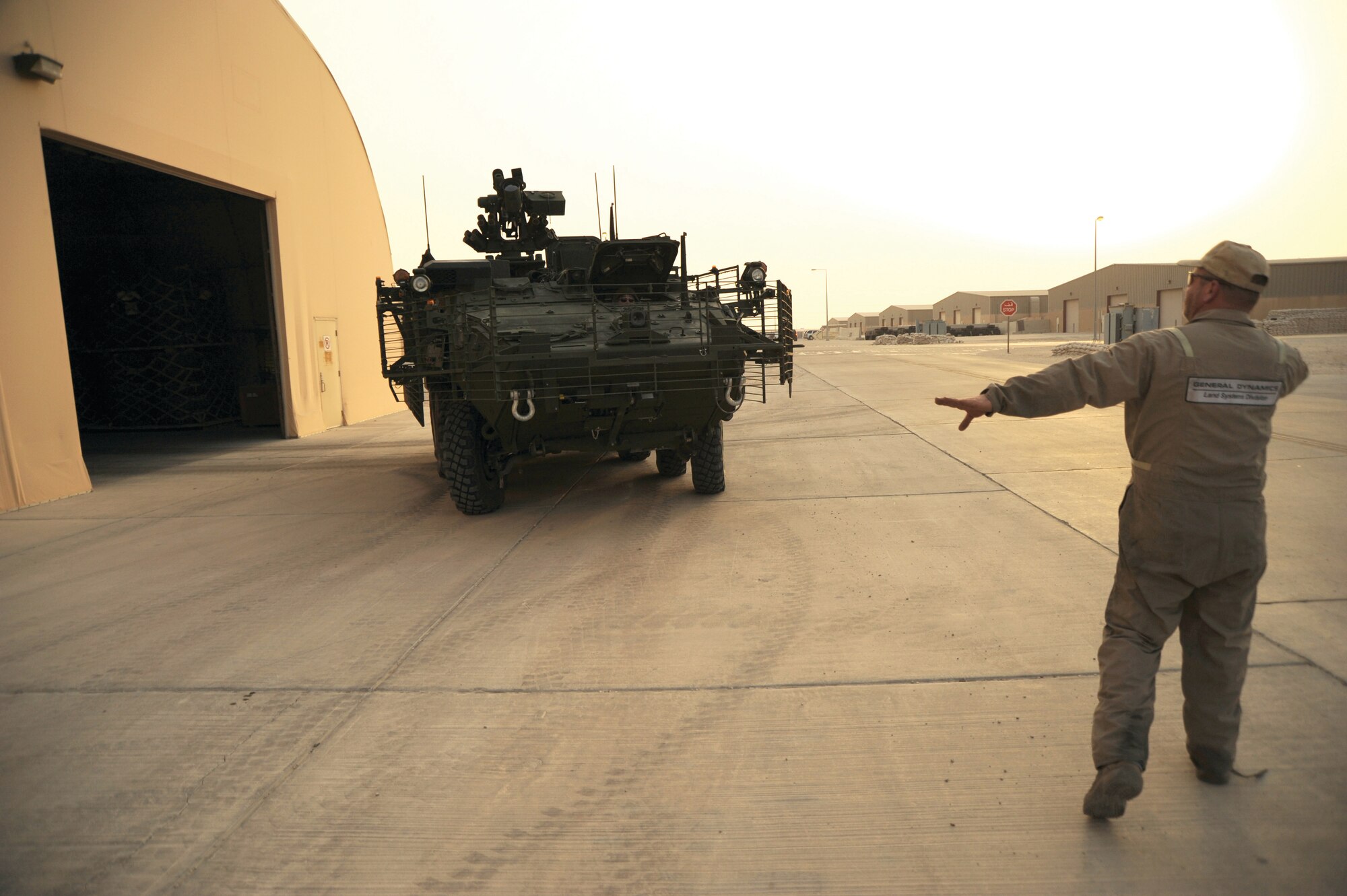 Steve Martin, BDRF vehicle electronics technician, assists Mark Romero,
BDRF return to fight fleet supervisor, in parking a Stryker after a drive on the test
track. The RtF is comprised of a fleet of repaired Strykers which are maintained at
the facility until requested by a unit downrange. (U.S. Air Force photo/Staff Sgt. Tim Jenkins)