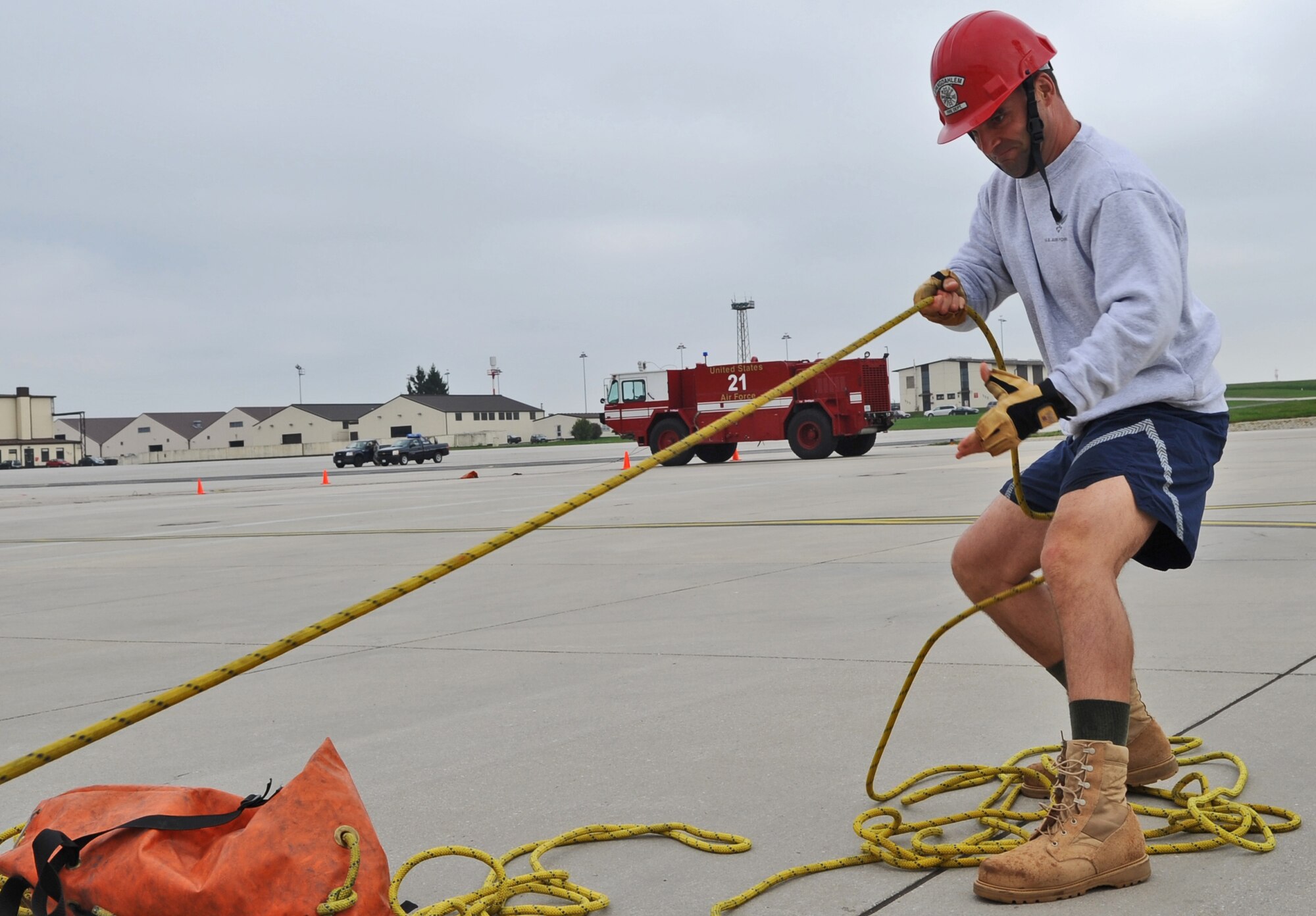 SPANGDAHLEM AIR BASE, Germany – Senior Master Sgt. James Lyda, 52nd Operations Support Squadron “Angry Chickens” fire muster team member, pulls a dummy during Spangdahlem’s first ever Fire Muster Challenge as part of Fire Prevention Week Oct. 9. Since 1922, Fire Prevention Week has taken place in the U.S. to increase fire safety awareness. (U.S. Air Force photo/Senior Airman Nick Wilson)