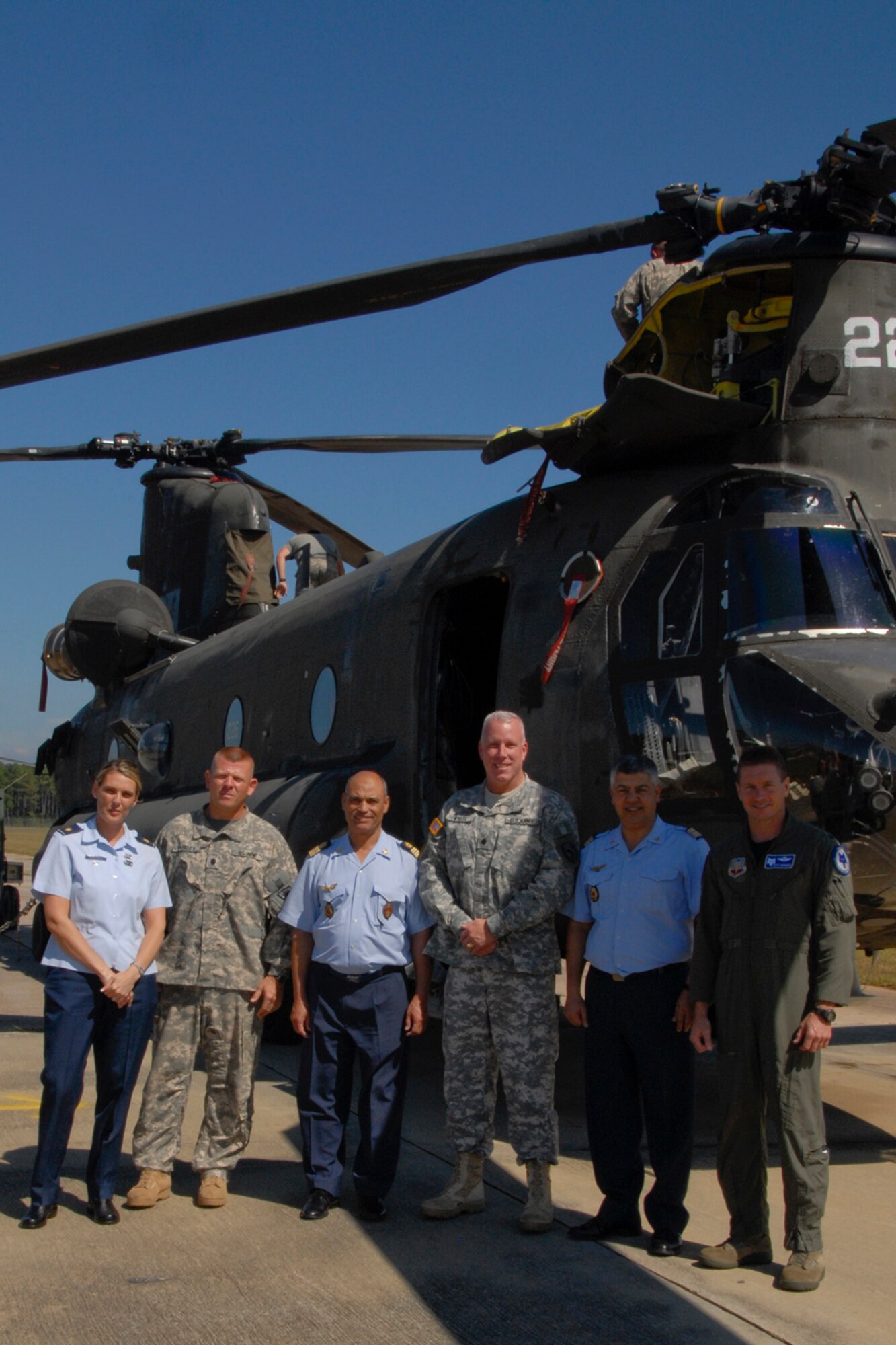 During a visit to McEntire Joint National Guard Base, Eastover S.C. September 28, 2010, Lt. Col. James Barkley, commander of the Army Aviation Support Facility, tours Colonel Major Moha Ouadadouch, Colonel Abdelhak Sanhaji, leaders in the Moroccan Air Force, and Army Lt. Col. Jeffery Wyatt, Sr., Air Force Lt. Col. Scott Bridgers and Maj. Karen Nuccitelli,  around the Army Aviation Support Facility. The Moroccan Air Force is preparing to construct a new base very much like McEntire with the same aircraft and mission requirements.  

(U.S. Army Photo by Staff Sgt. Tracci Dorgan on 28 September 2010 - RELEASED by Senior Master Sgt. Edward Snyder, 169th Fighter Wing Public Affairs, (803) 647-8316, edward.snyder@ang.af.mil)

