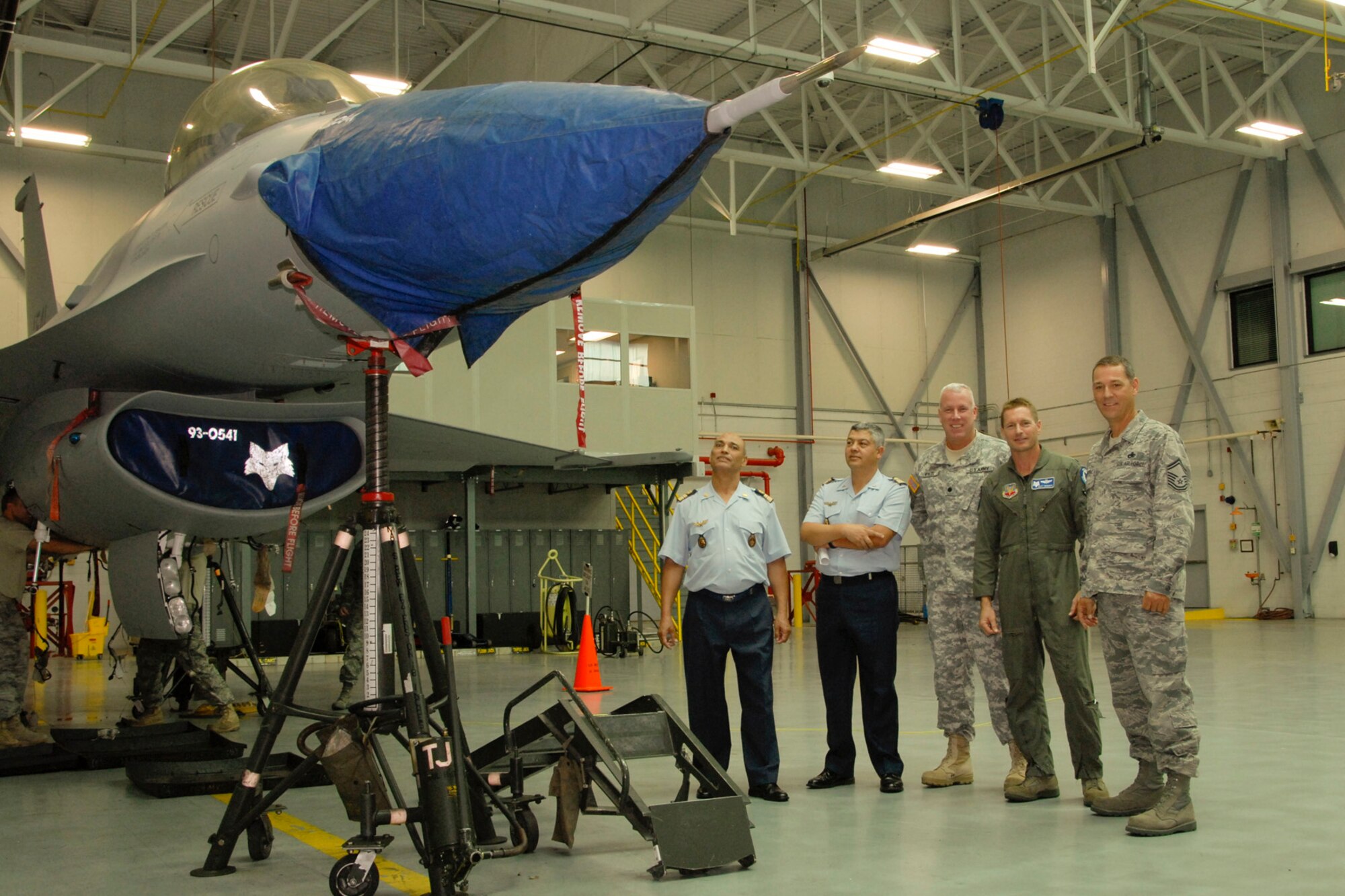 During a visit to the 169th Fighter Wing in the South Carolina Air National Guard on McEntire Joint National Guard Base, Eastover S.C. September 28, 2010. SMSgt. Barry Boyle, supervisor in the 169th Maintenance Squadron, explains the use of the Phase Dock to Colonel Major Moha Ouadadouch, Colonel Abdelhak Sanhaji, leaders in the Moroccan Air Force. Army Lt. Col. Jeffery Wyatt, Sr.,  Air Force Lt. Col. Scott Bridgers and Capt. Grady Patterson IV visits with them.  The Moroccan Air Force is preparing to construct a new base very much like McEntire with all the same aircraft and mission requirements.  

(U.S. Army Photo by Staff Sgt. Tracci Dorgan on 28 September 2010 - RELEASED by Senior Master Sgt. Edward Snyder, 169th Fighter Wing Public Affairs, (803) 647-8316, edward.snyder@ang.af.mil)