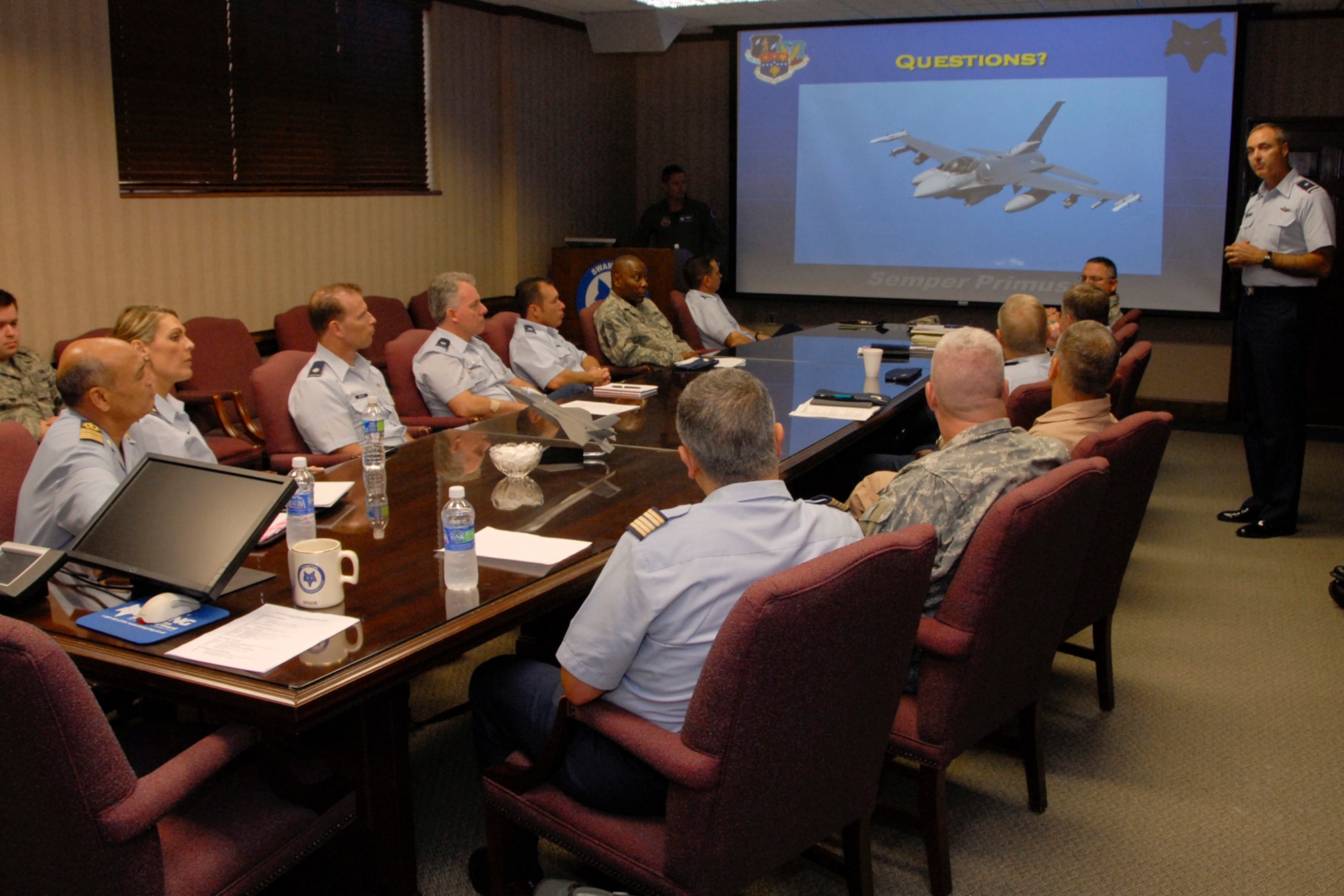 During a brief by Brig. Gen. Scott Williams, commander of the 169th Fighter Wing in the South Carolina Air National Guard on McEntire Joint National Guard Base, Eastover S.C. September 28, 2010. Colonel Major Moha Ouadadouch, Colonel Abdelhak Sanhaji, leaders in the Moroccan Air Force, sit around the briefing table with Army Lt. Col. Jeffery Wyatt, Sr., Air Force Col. Michael Hudson, Lt. Col. David Meyer, Maj. Karen Nuccitelli and many other leaders of the SCANG.   The Moroccan Air Force is preparing to construct a new base very much like McEntire with all the same aircraft and mission requirements.  

(U.S. Army Photo by Staff Sgt. Tracci Dorgan on 28 September 2010 - RELEASED by Senior Master Sgt. Edward Snyder, 169th Fighter Wing Public Affairs, (803) 647-8316, edward.snyder@ang.af.mil)