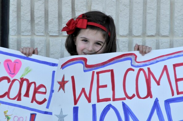 PATRICK AIR FORCE BASE, Fla. - Ella Woodruff, 5, and her mother, Lauren, of Orlando, show up here and wait for their Airmen, 1st Lt. Patrick Woodruff, as he pilots home a wing HC-130P/N King aircraft after a 45-day deployment to the Horn Africa October 15, 2010. He and a crew of 5 Airmen from the 920th Rescue Wing flew the aircraft all from Africa to Florida with 20 Airmen aboard. The Air Force Reservists were deployed to the nation to provide combat search and rescue support. All together 63 Reservists were deployed for 45 days. The Wing is one of the most called upon units in the nation. Airmen deploy often supporting combat search and rescue worldwide. (U.S. Air Force Photo/Capt. Cathleen Snow)