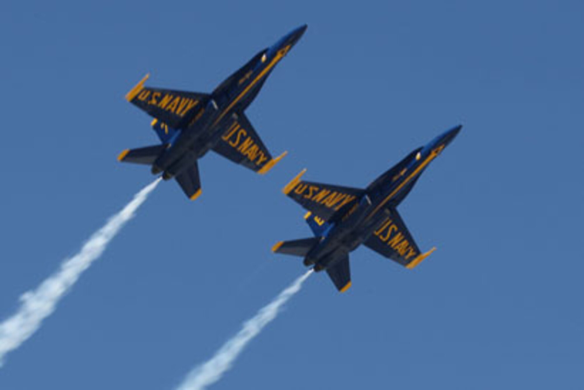 Two Blue Angel F-18 Hornets fly high while proudly displaying U.S. Navy on the underside of their wings during their practice performance Oct. 15.
(U.S. Air Force Photo/Don Peek)
