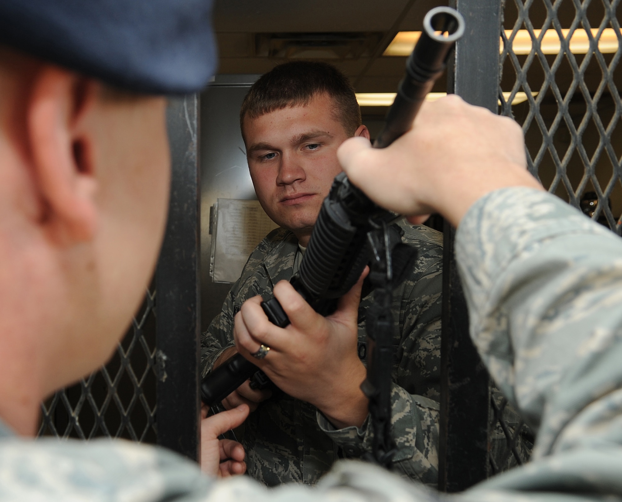 MOUNTAIN HOME AIR FORCE BASE, Idaho -- Airman 1st Class John Dickinson, Security Forces Squadron defender, checks in an M-4 Carbon at the armory Sep 21. Security forces provide integrated defense and law enforcement for the base and develop highly trained Airmen to support deployed contingency operations. (U.S. Air Force photo by Senior Airman Roy Lynch)