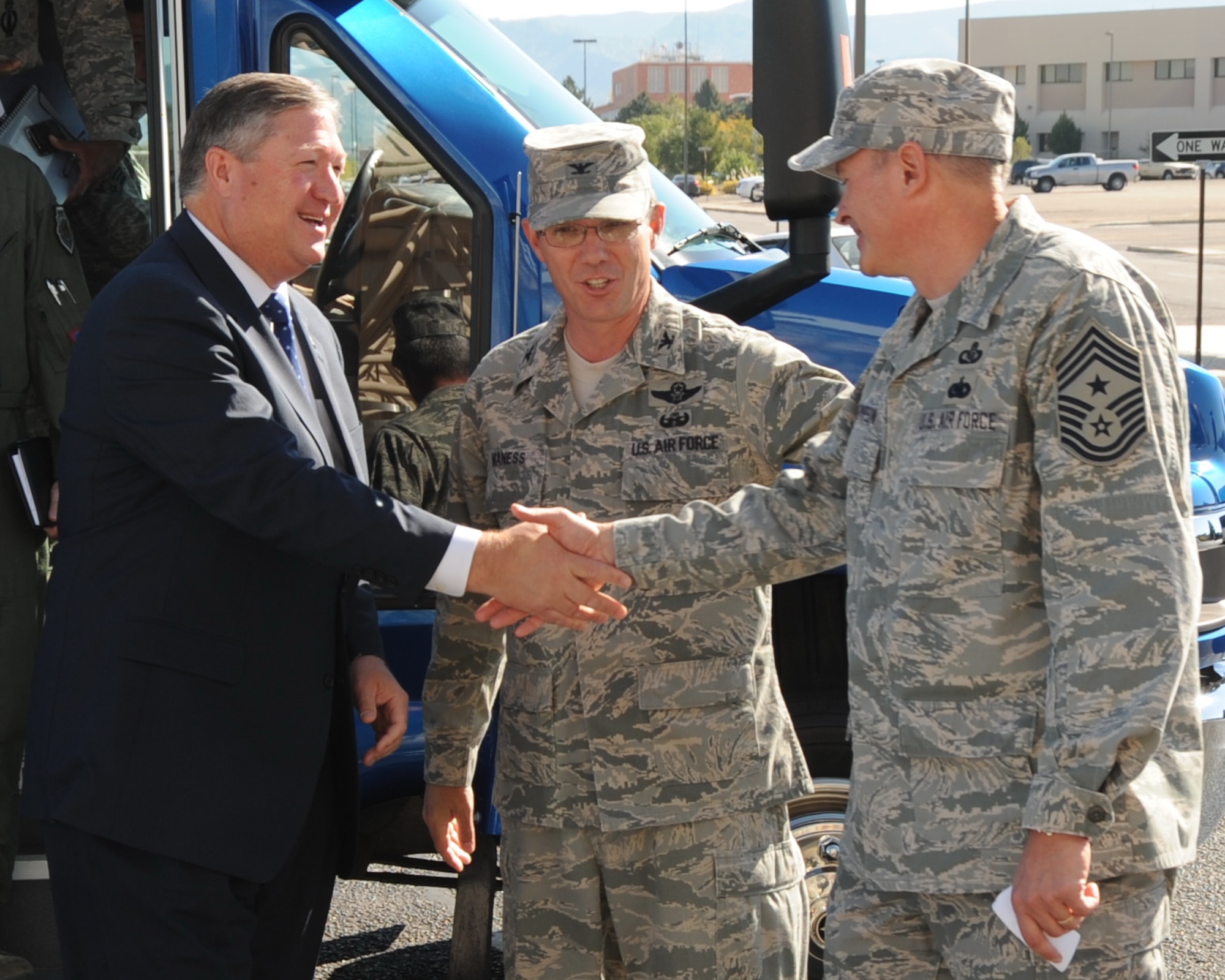 Secretary of the Air Force Michael Donley is greeted by Col. Robert Maness, the 377th Air Base Wing commander, and Chief Master Sgt. Lee Thompson, the 377th ABW command chief, Oct. 14, 2010, as he arrives for an “All Call” at the Kirtland Air Force Base, N.M., base theater.  (U.S. Air Force photo)