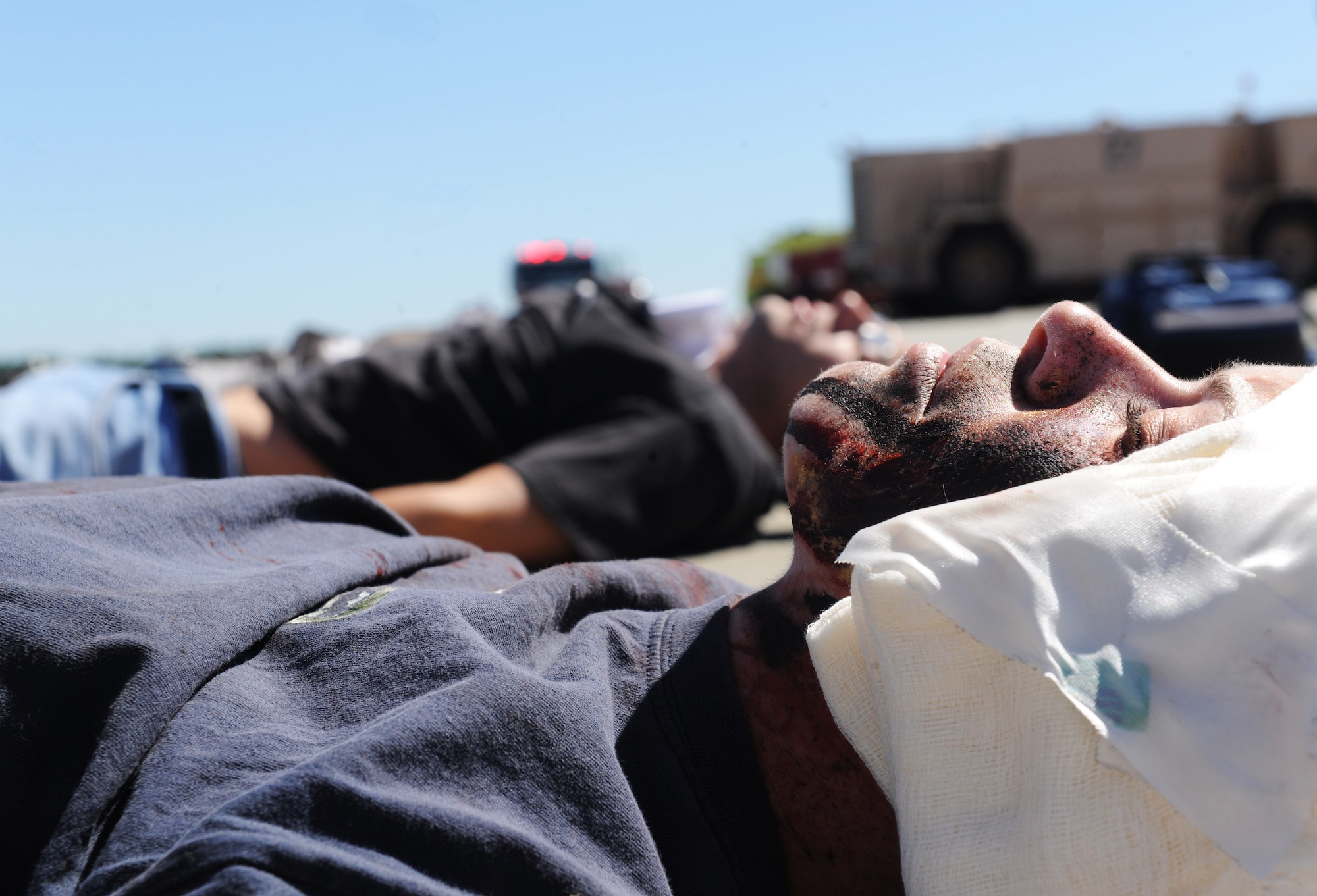 MOODY AIR FORCE BASE, Ga. -- Airman 1st Class Angelique Smith, 23rd Operations Support Squadron air traffic controller, lies with other moulage victims during a Major Accident Response Exercise held here Oct. 15. The severely injured victims were transported via ambulance to South Georgia Medical Center. (U.S. Air Force photo/Airman 1st Class Benjamin Wiseman)