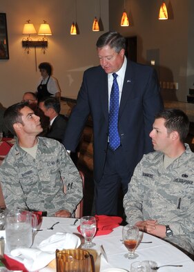 Secretary of the Air Force Michael Donley chats with Airmen at lunch Oct. 14, 2010, during his visit to Kirtland Air Force Base, N.M.  (U.S. Air Force photo)