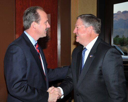 Secretary of the Air Force Michael Donley, while visiting the men and women of Kirtland Air Force Base, N.M., is greeted by Richard Berry, mayor of Albuquerque, as he arrives downtown for the Albuquerque Chamber of Commerce Banquet Oct 13, 2010.  (U.S. Air Force photo)