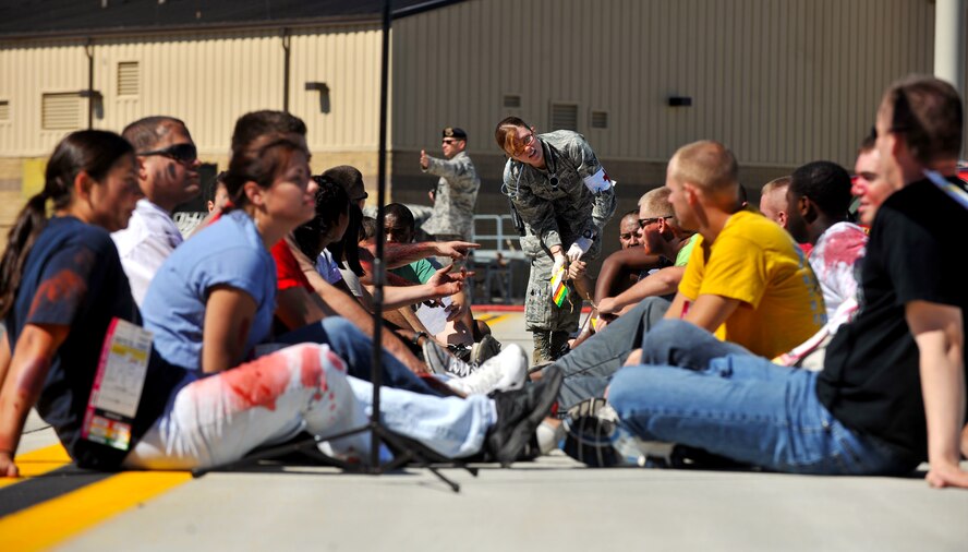 MOODY AIR FORCE BASE, Ga. -- A group of individuals sit in rows waiting to be helped during a Major Accident Response Exercise here Oct. 15. It was held in preparation for the upcoming Community Appreciation Day Airshow on Nov. 13., which has an expected crowd of many tens of thousands. The community can rest assure that the 23rd Medical Group, other supporting base agencies, and local and regional medical personnel, are prepared to respond to anything that may happen. (U.S. Air Force photo/Airman 1st Class Joshua Green)

