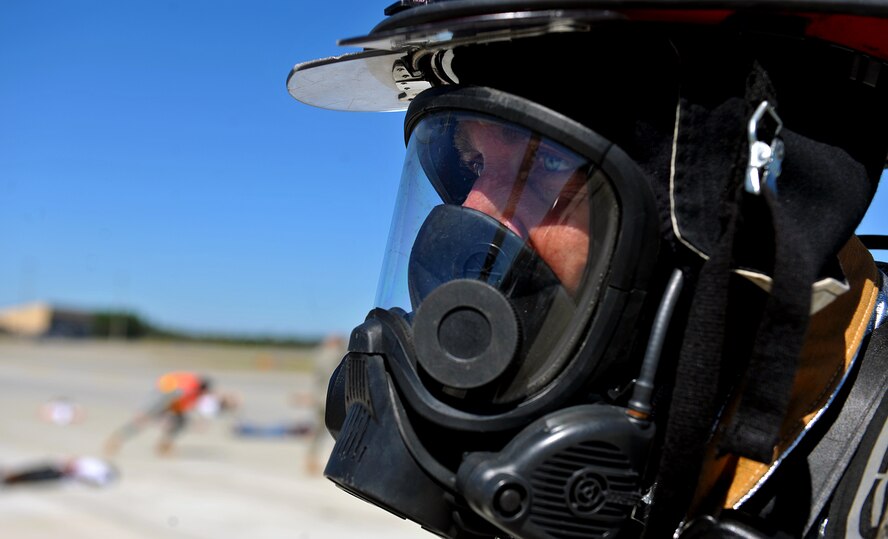MOODY AIR FORCE BASE, Ga. -- A firefighter from the 23rd Civil Engineer Squadron emergency services flight looks toward moulage victims during a Major Accident Response Exercise here Oct. 15. The exercise required members from various agencies from on and off base to respond to a simulated plane crash in preparation for the upcoming Community Appreciation Day Airshow Nov. 13. (U.S. Air Force photo/Airman 1st Class Joshua Green)
