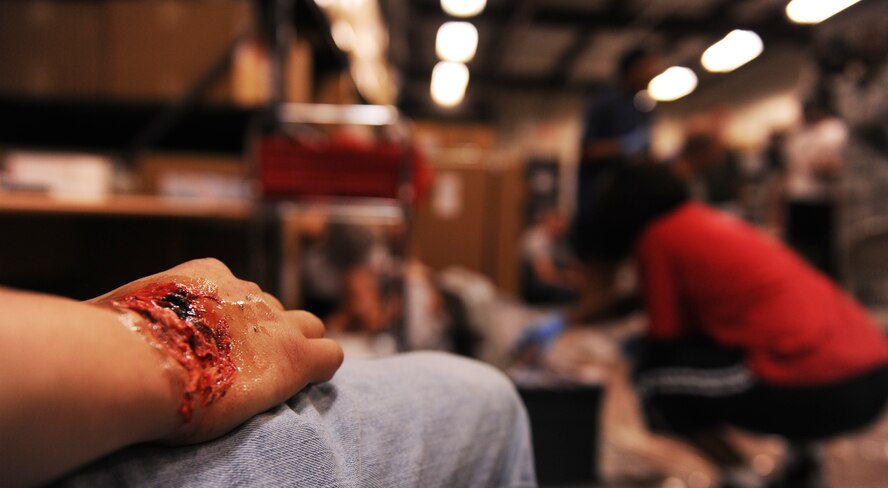 MOODY AIR FORCE BASE, Ga. -- A moulaged injured hand sits as another volunteer is prepared for the Major Accident Response Exercise held here Oct. 15. Victims were moulaged as real as possible for the exercise to include life-threatening injuries and slight burns. (U.S. Air Force photo/Airman 1st Class Benjamin Wiseman)
