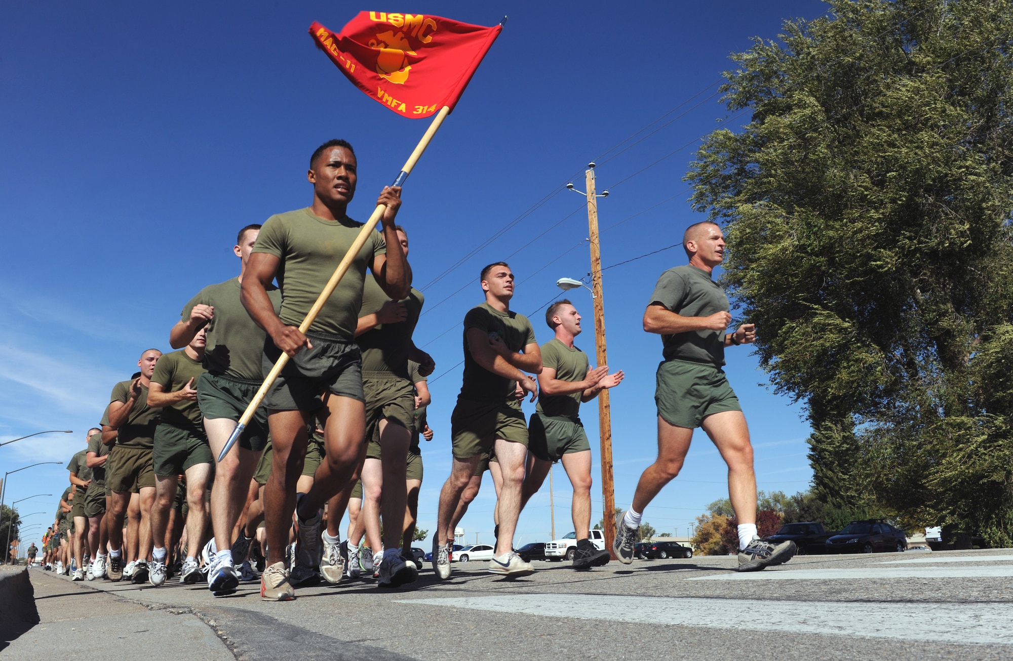 MOUNTAIN HOME AIR FORCE BASE, Idaho – Lt. Col. Max Cain, 314th Marine Fighter Attack Squadron commander, (right) and Corporal Anthony Shines, 314th VMFA black knight from Mirimar, Calif., lead Marines on a formation run around base Oct. 14. The squadron is participating in the annual Mountain Round Up exercise. (U.S. Air Force photo by Senior Airman Debbie Lockhart)