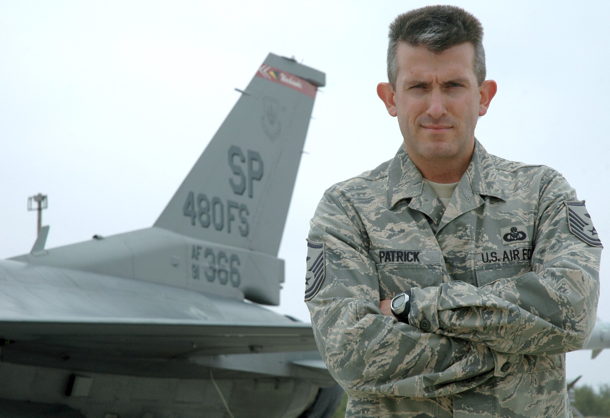 Master Sgt Michael Patrick stands in front of an F-16 Fighting Falcon bearing his squadron's tail flash Oct. 13, 2010. Sergeant Patrick is the 480th Fighter Squadron first sergeant. He returned to the 480th FS after nearly 20 years to serve as the first sergeant for the three-week combined exercise that gave both U.S. and Bulgarian airmen the opportunity to train together and strengthen relationships. (U.S. Air Force photo/Maj. Jillian Torango)