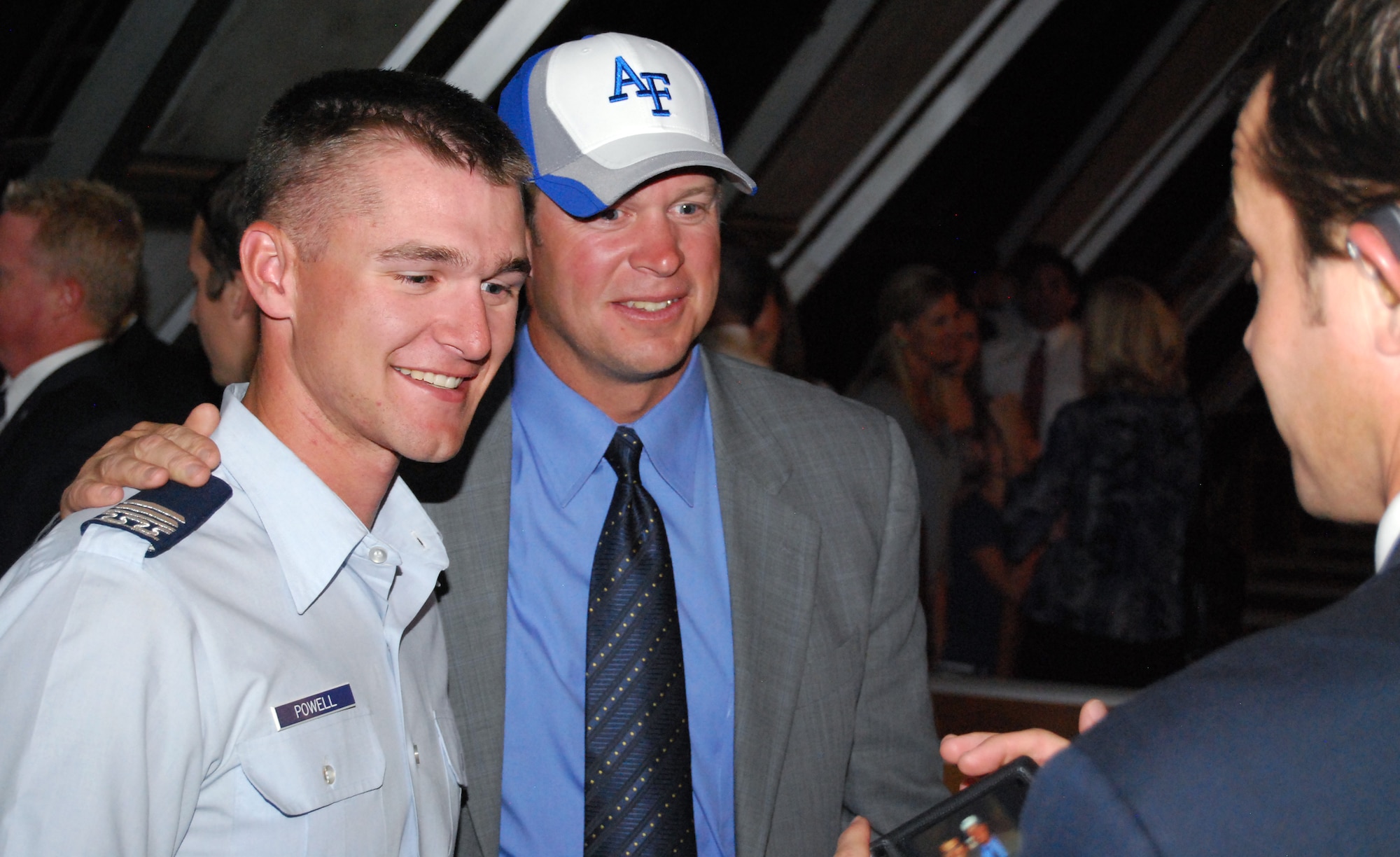 Cadet 1st Class Caleb Powell gets a photo next to BYU football head coach Bronco Mendenhall after a Mormon worship service led by Mendenhall in the Air Force Academy's Cadet Chapel Sept. 10, 2010. Air Force Academy cadets joined visiting BYU football players services on the eve of the Air Force-BYU game at Falcon Stadium Sept. 11. (U.S. Air Force photo/Staff Sgt. Don Branum)