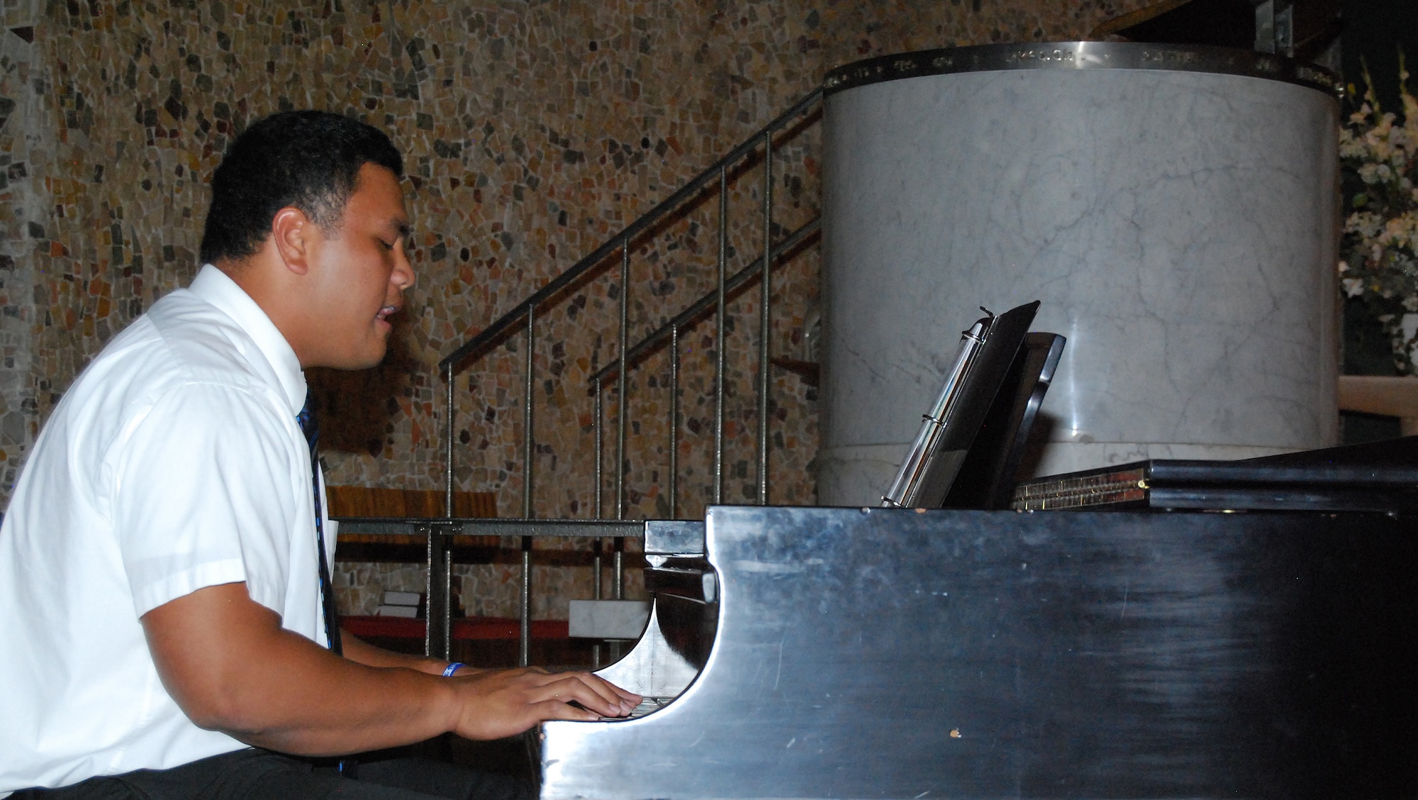 BYU student Walter Kahaialii performs a hymn at a Mormon worship service in the Air Force Academy's Cadet Chapel Sept. 10, 2010. Mr. Kahaialii, a native of Maui, Hawaii, is an offensive lineman for the Cougars football team. BYU head football coach Bronco Mendenhall led the service on the eve of the Air Force-BYU football game at Falcon Stadium. (U.S. Air Force photo/Staff Sgt. Don Branum)