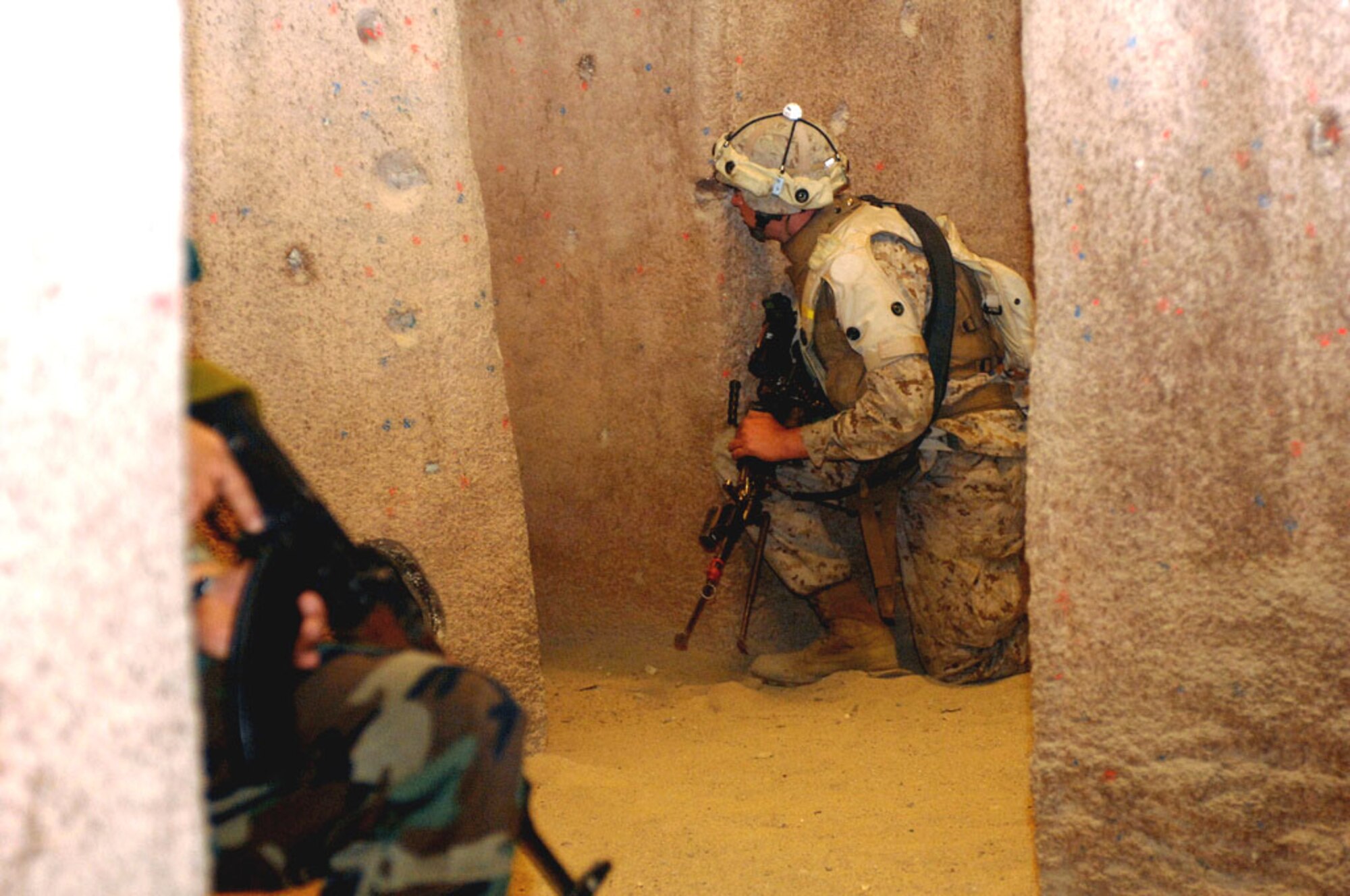 Marines interact with role-players and respond to hostile actions in a mock Afghan village setup at Camp Pendleton's Infantry Immersion Trainer during U.S. Joint Forces Command's Future Immersive Training Environment Joint Capability Technology Demonstration. The scenarios were designed using real experiences as templates. (U.S. Army photo/Sgt. Josh LeCappelain)