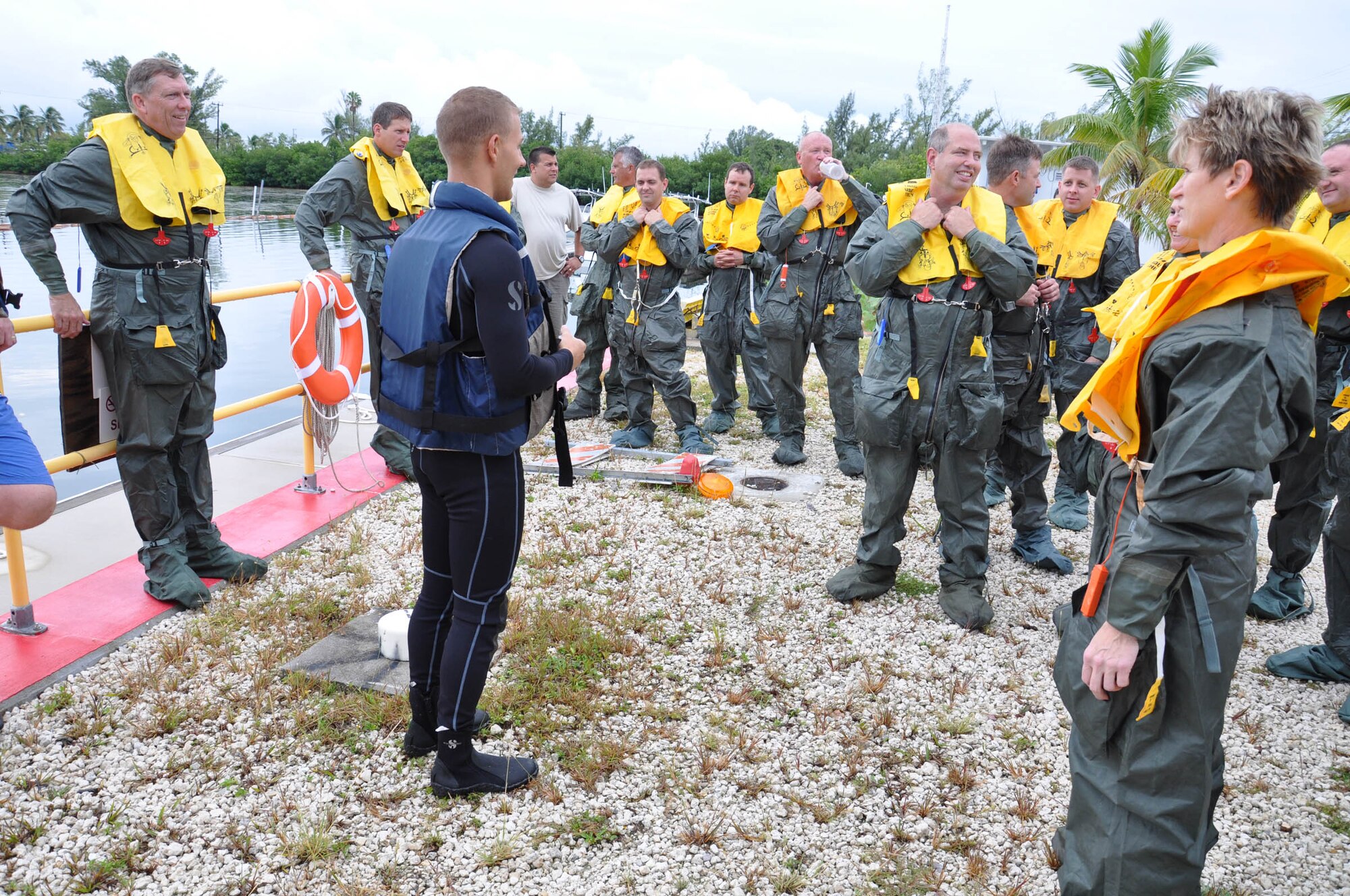 WRIGHT-PATTERSON AIR FORCE BASE, Ohio – Tech. Sgt. Cassidy Helregel, 445th Operation Support Squadron, briefs reservists from the 445th Aeromedical Evacuation Squadron and 89th Airlift Squadron on safety prior to boarding a U.S. Navy vessel Oct. 14. The Airmen were taking part in their two-day semi-annual water survival training requirement at the Naval Air Station in Key West, Fla. (U.S. Air Force photo/Staff Sgt. Robert Nelson)