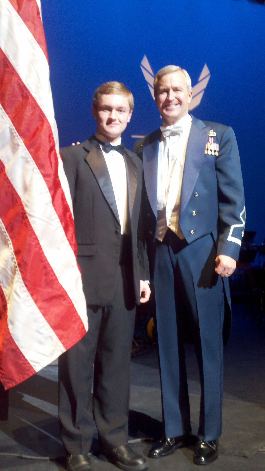 Lt Col Larry Lang, Commander and Conductor of the USAF Academy Band, poses with Riley Fitzgerald from the Verison Honors High School Band in Mesa, AZ. Riley augmented the USAF Academy Band through the Academy Band's Education Outreach Program during the performance on the the Air Force Musician's Association March.