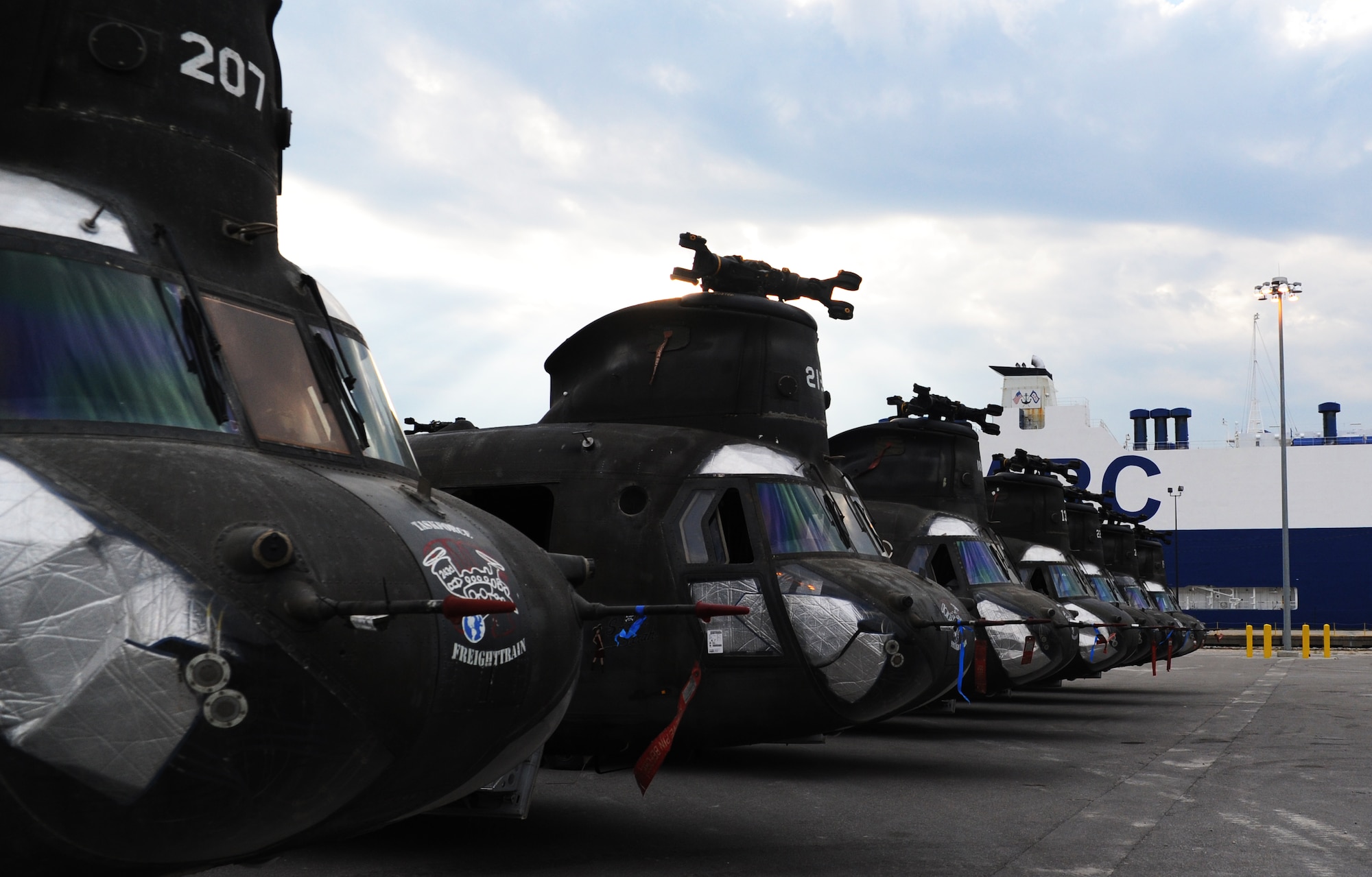 CH-47 Helicopters sit on a temporary storage lot until contractors can inspect and reassembled them for further transport at the TC dock Oct. 14, 2010, on Joint Base Charleston Weapons Station, S.C. The CH-47 Chinook is a twin-engine, tandem rotor heavy-lift helicopter that was designed by Boeing Vertol in the early 1960s. (U.S. Air Force photo/Senior Airman Timothy Taylor)